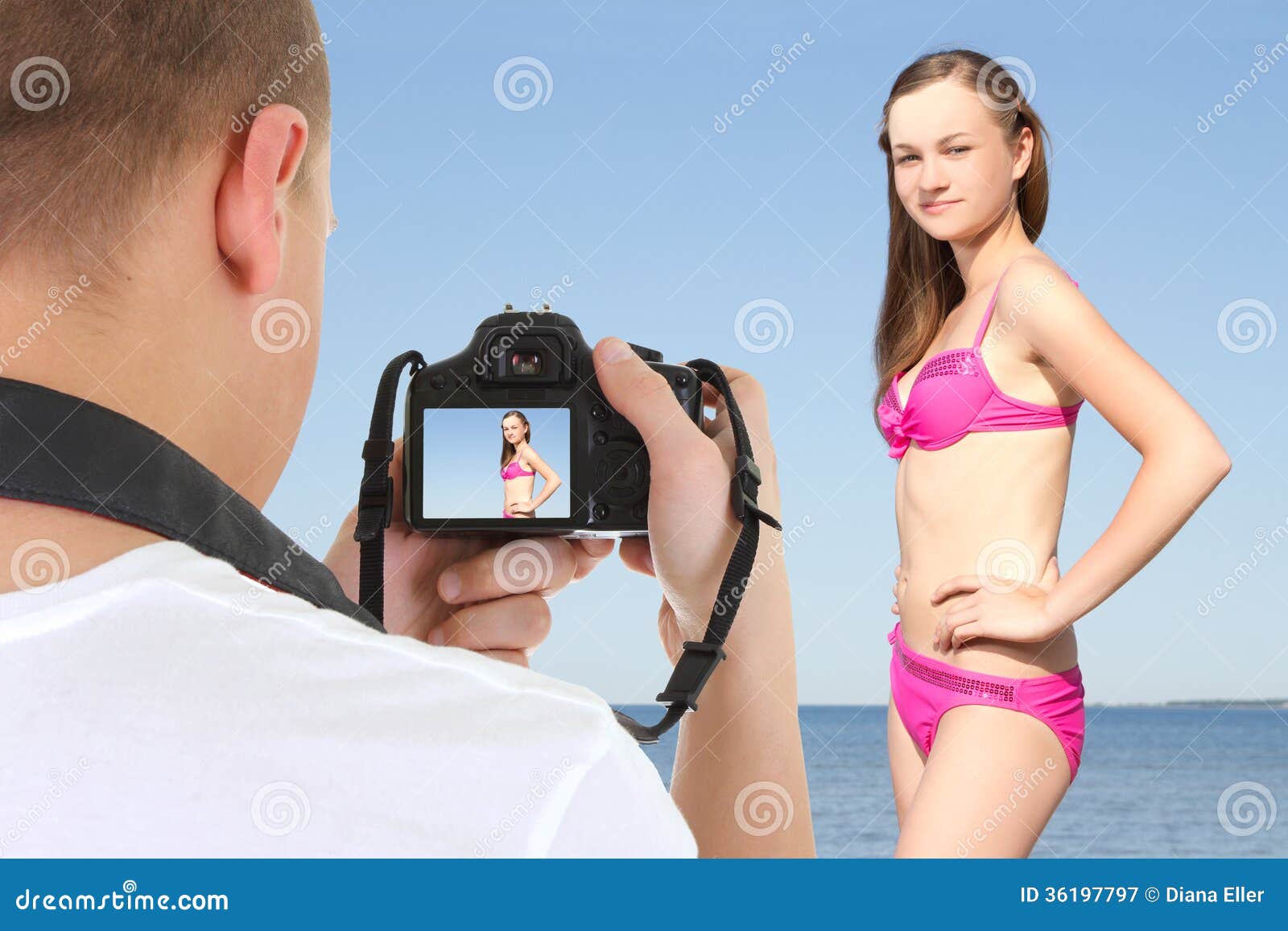 Photographer With Dslr Camera Taking Picture Of Beautiful