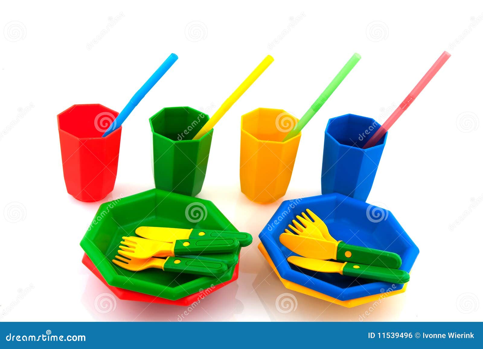 Colorful plasticpicnic set with drinking straws isolated over white.