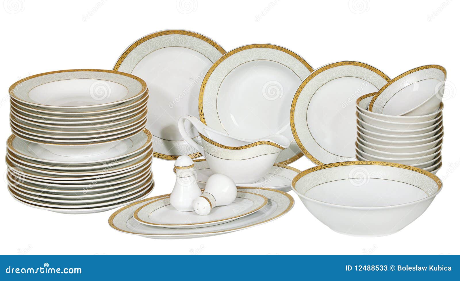 Set of fresh washed plates and dishes isolated on white.