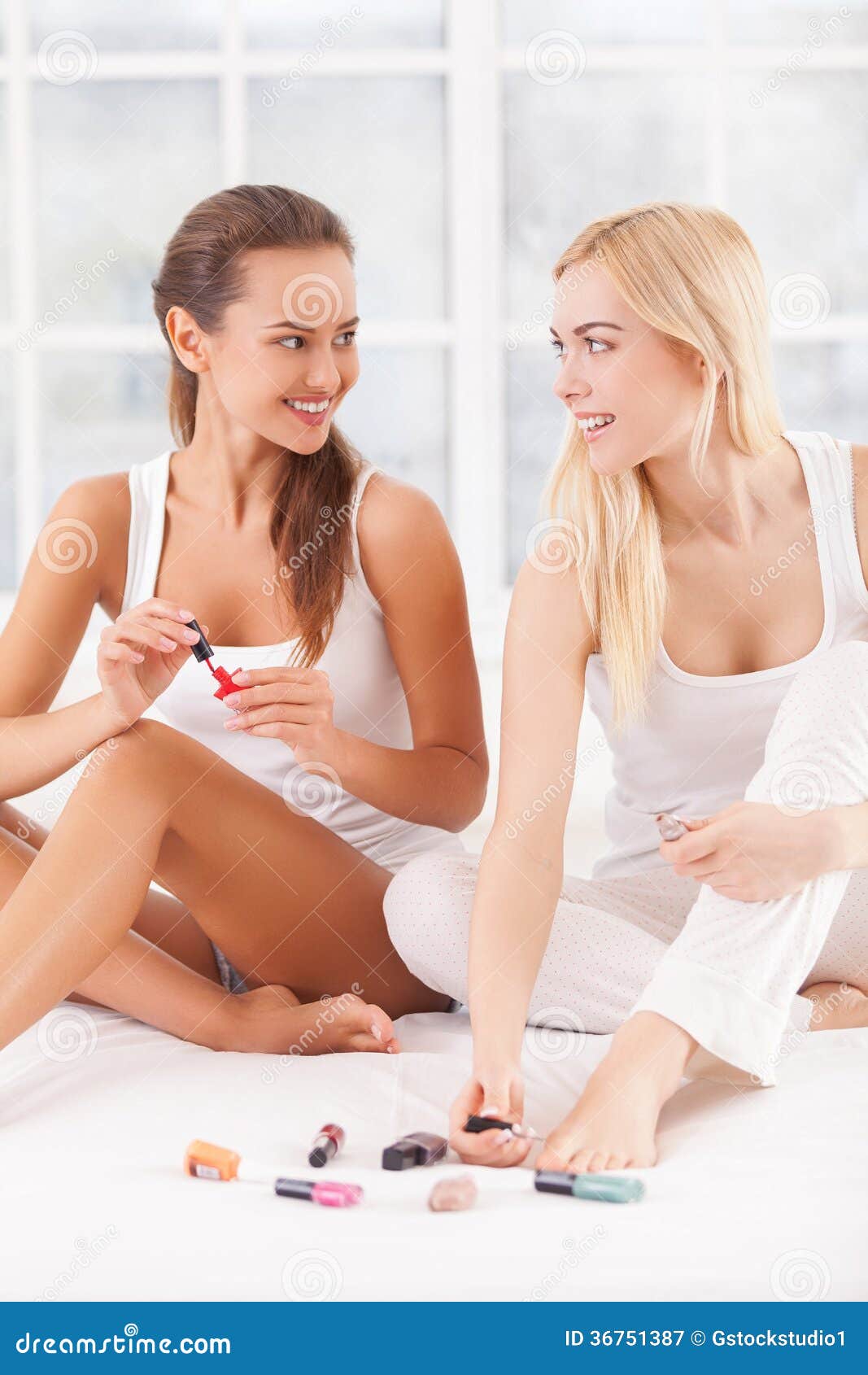 Polishing Their Nails Together. Royalty Free Stock Photography - Image 