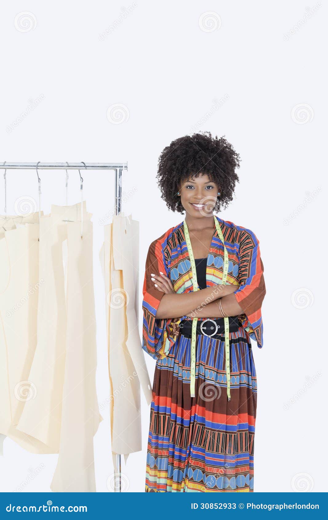 of an African American female designer with sewing patterns on clothes