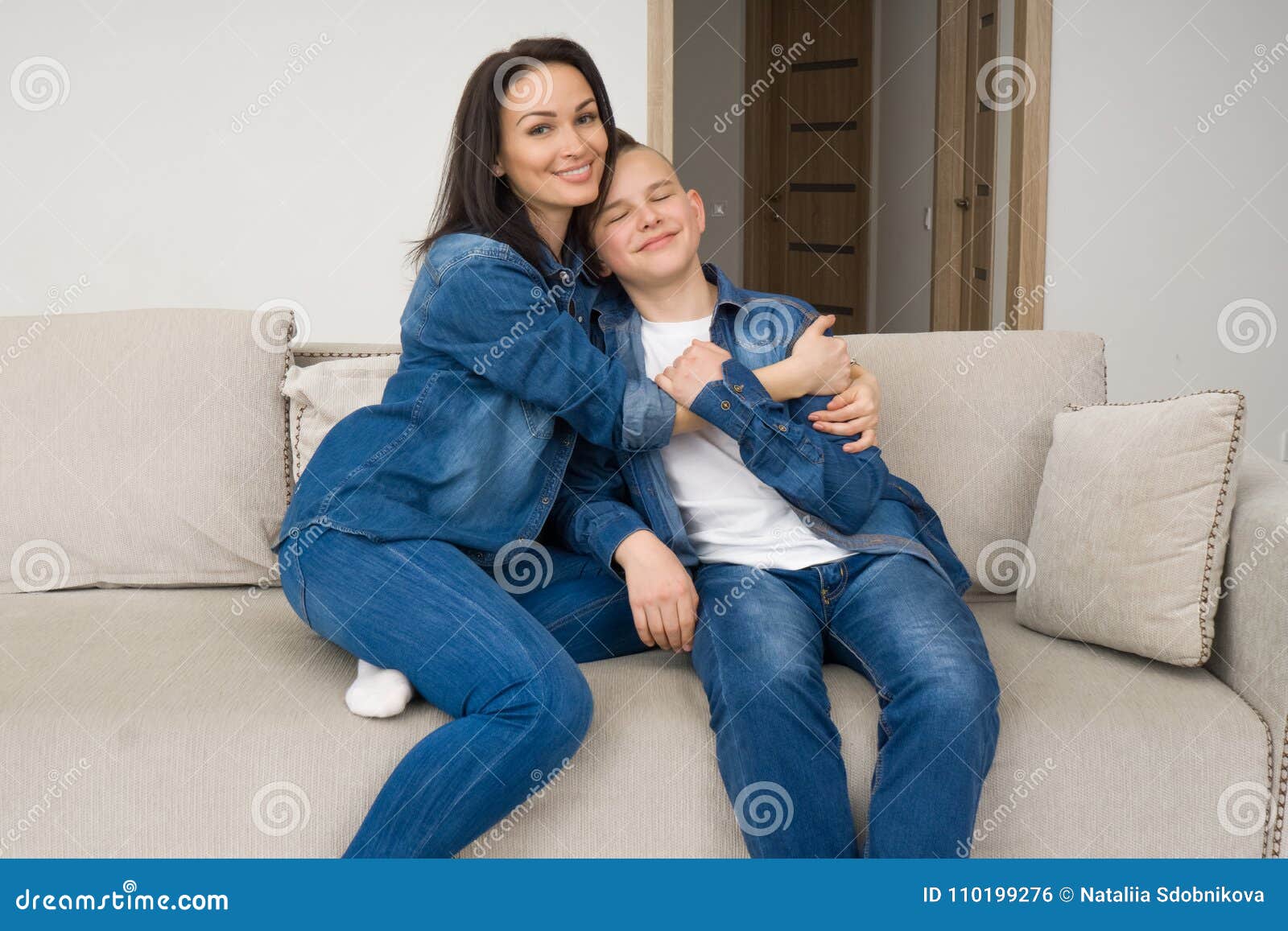 Portrait Of Mother And Her Son On Sofa At Home Stock Photo Image Of