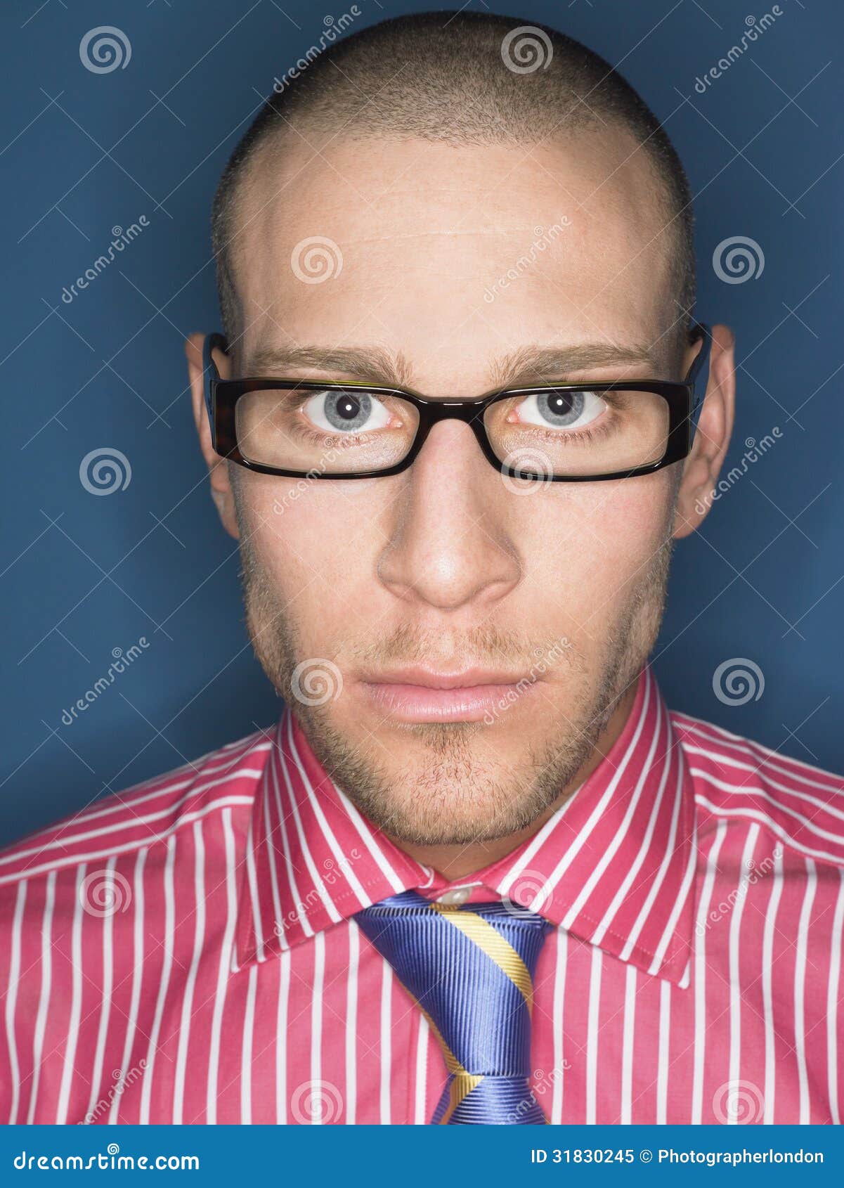Portrait Of Serious Bald Man In Glasses Royalty Free Stock Photo