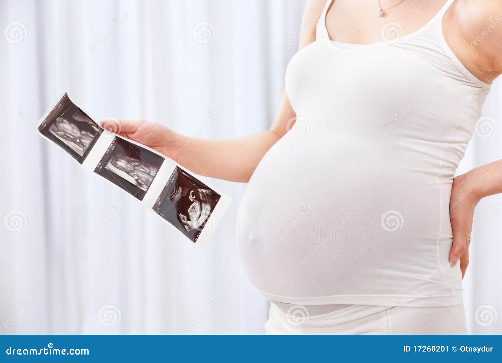 Pregnant Women Holding Ultrasound Picture