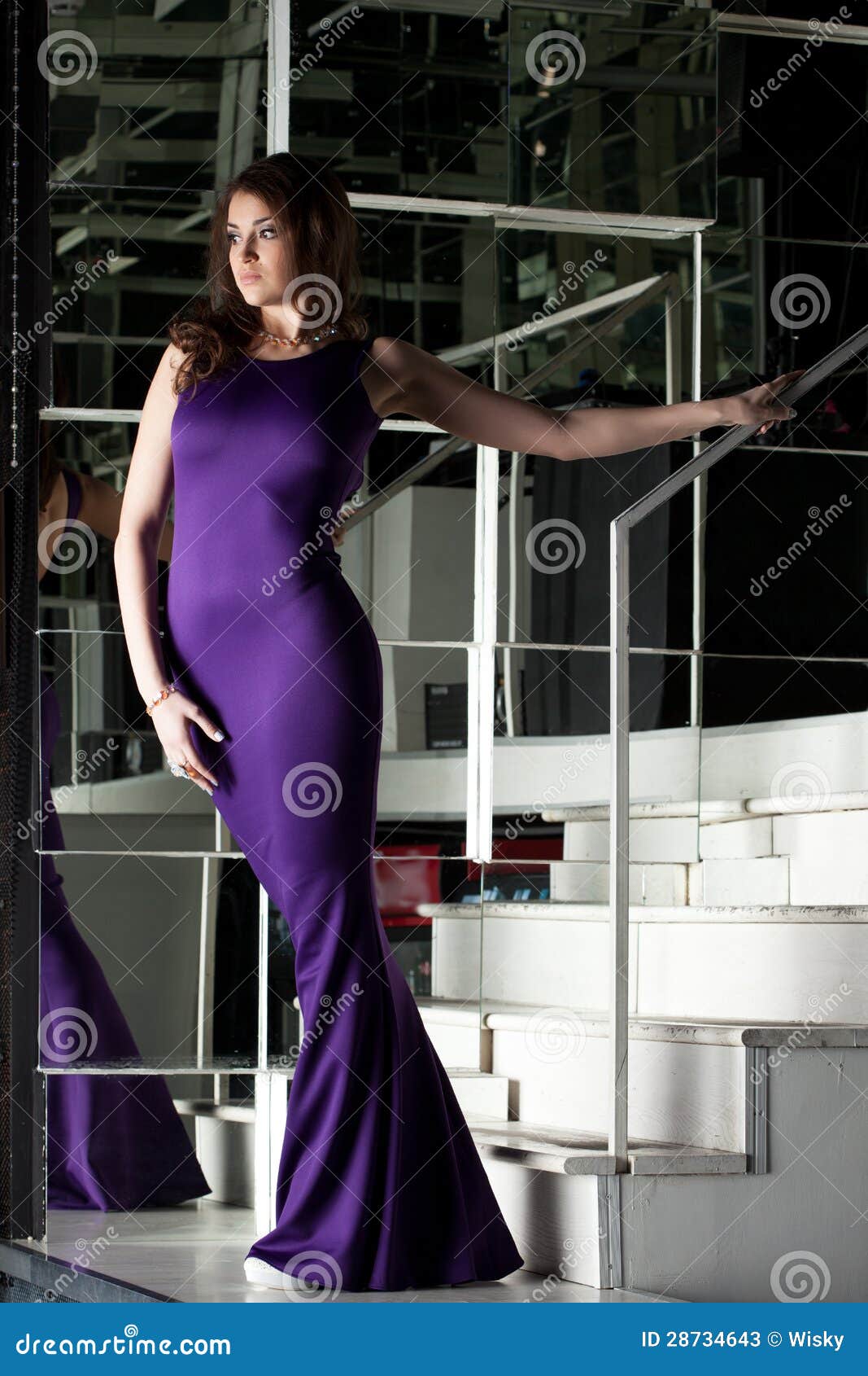 pretty-brunette-woman-long-purple-dress-28734643.jpg