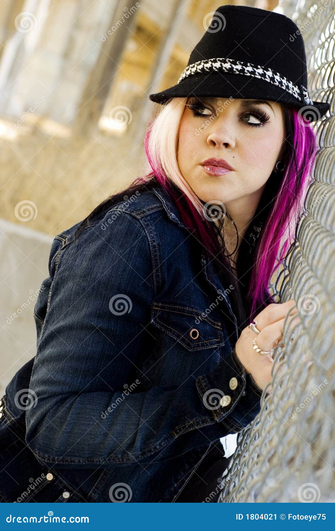 Punk+Models Punk Goth Female Fashion Model against chainlink fence.