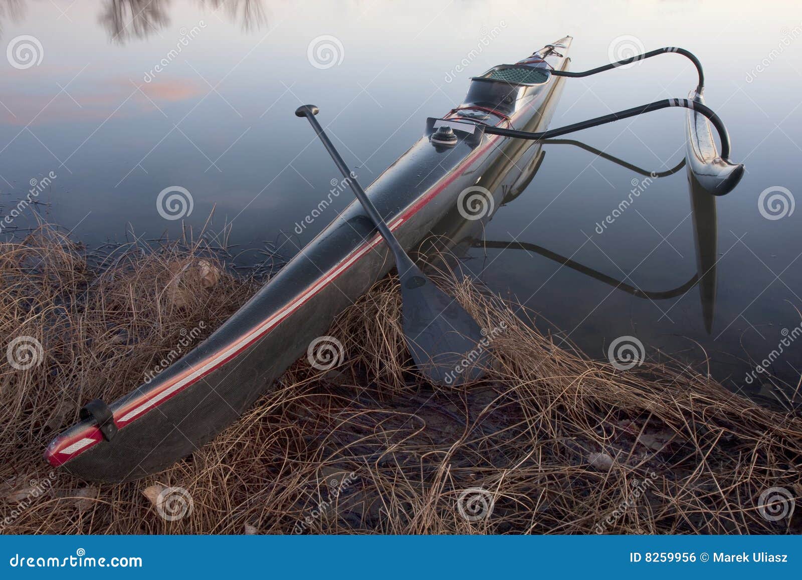 Racing Outrigger Canoe On A Calm Lake Royalty Free Stock Image - Image 