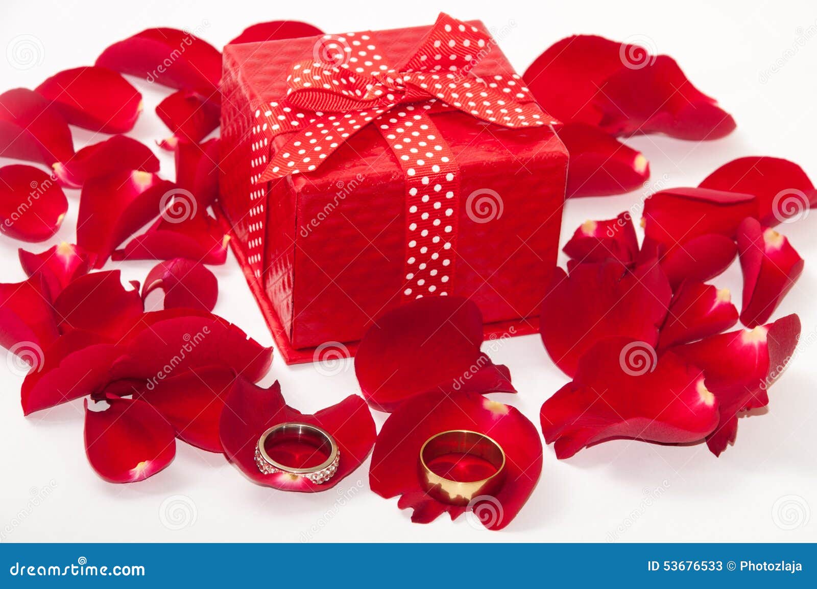 wedding rings on single rose petal