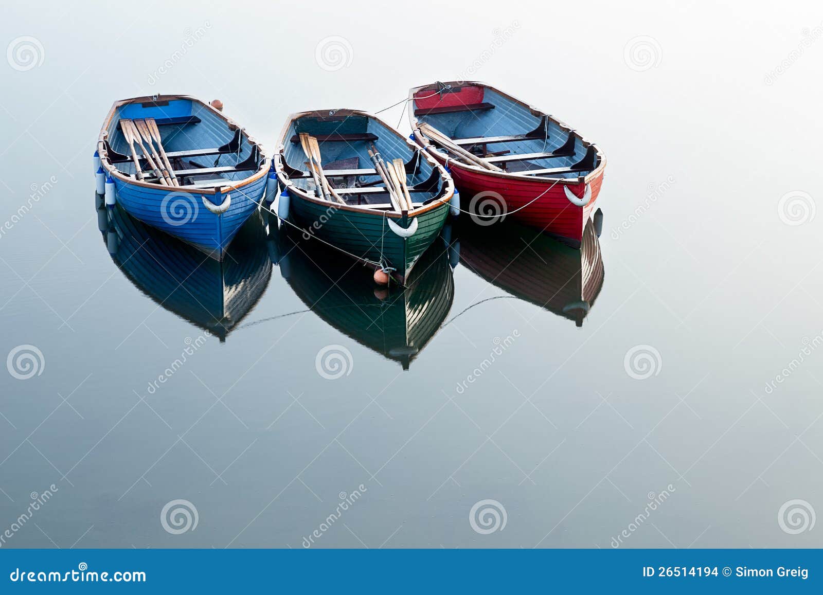 boats on clear water with the only reflections coming from the boats 