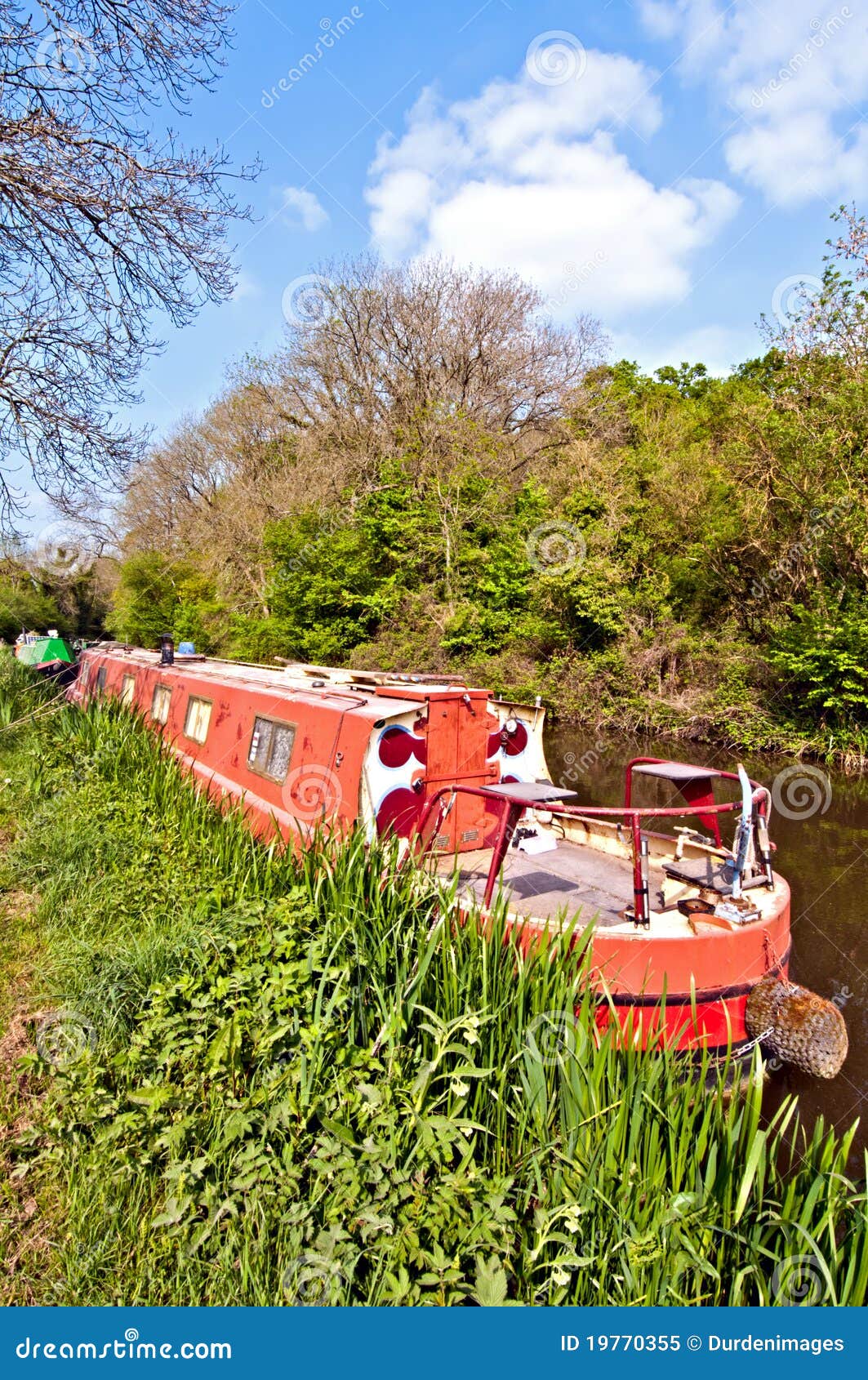 narrowboat moored on the side of the Kennet and Avon canal.