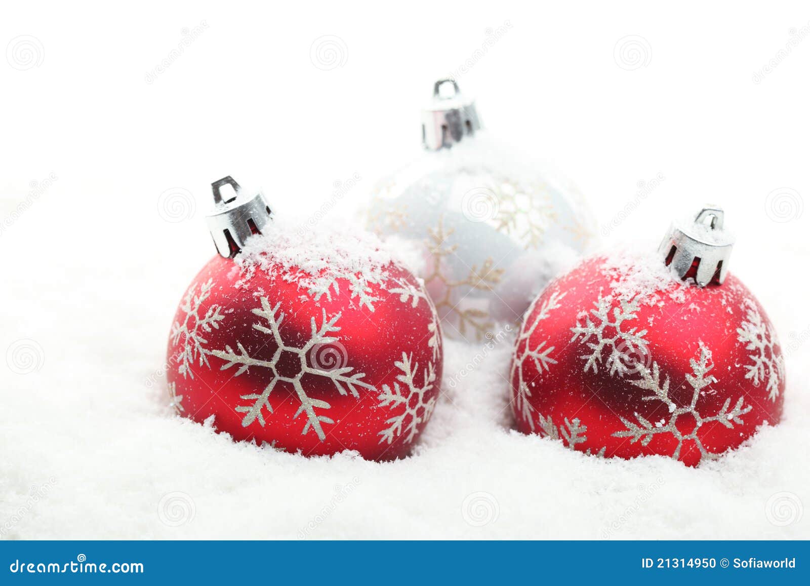 red and white christmas balls in snow flakes stock photo red and white christmas balls in snow flakes stock photo