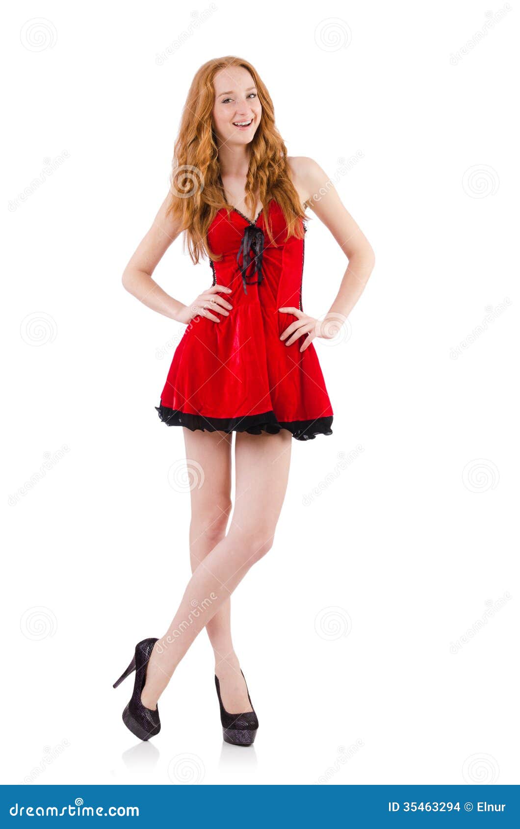 Redhead in red dress on white background. Redhead in red dress on white background.