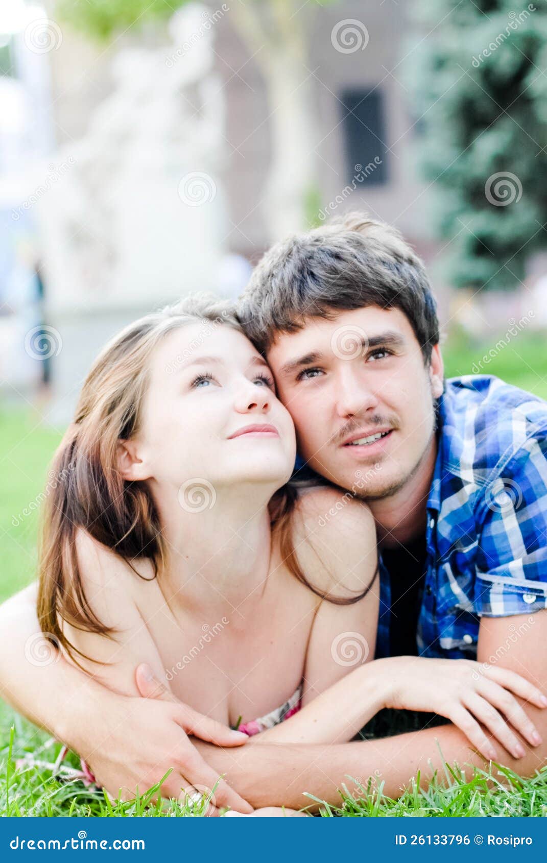 Romantic Couple In Love Embracing Lying Outdoors Royalty Free Stock