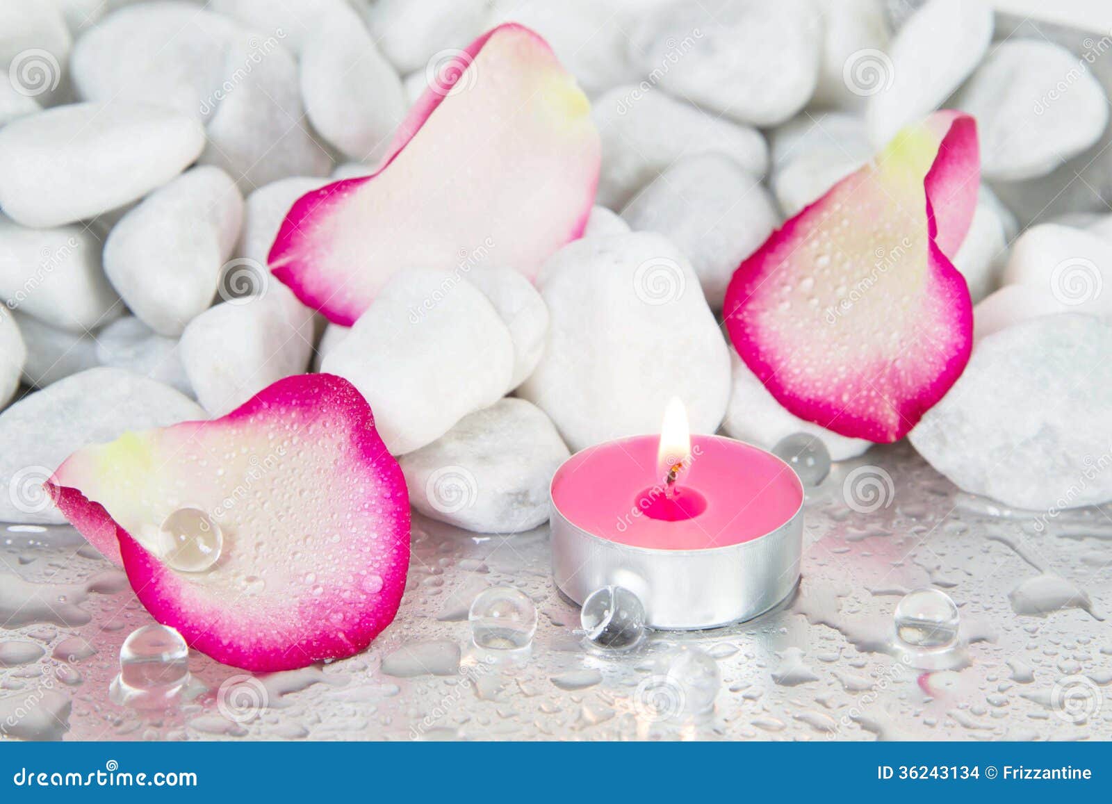 Rose Petals And A Lit Candle For A Spa Decoration Stock Images ...