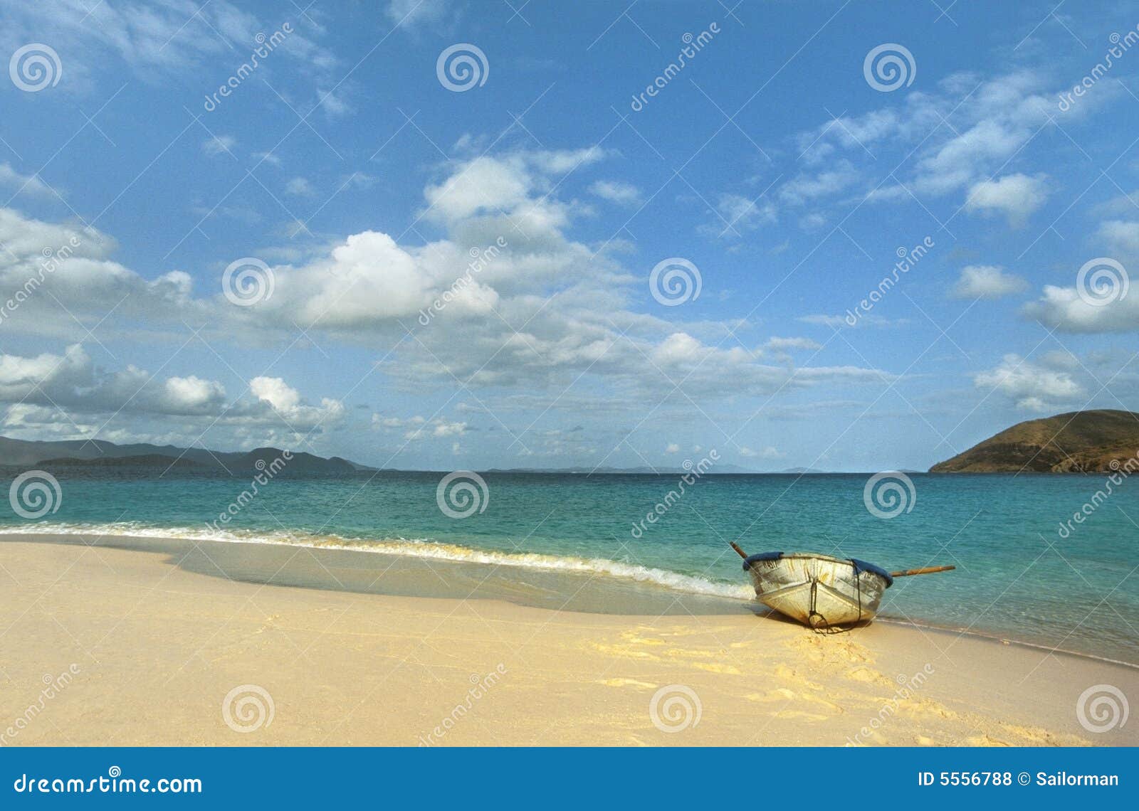 row boat on Caribbean island beach.