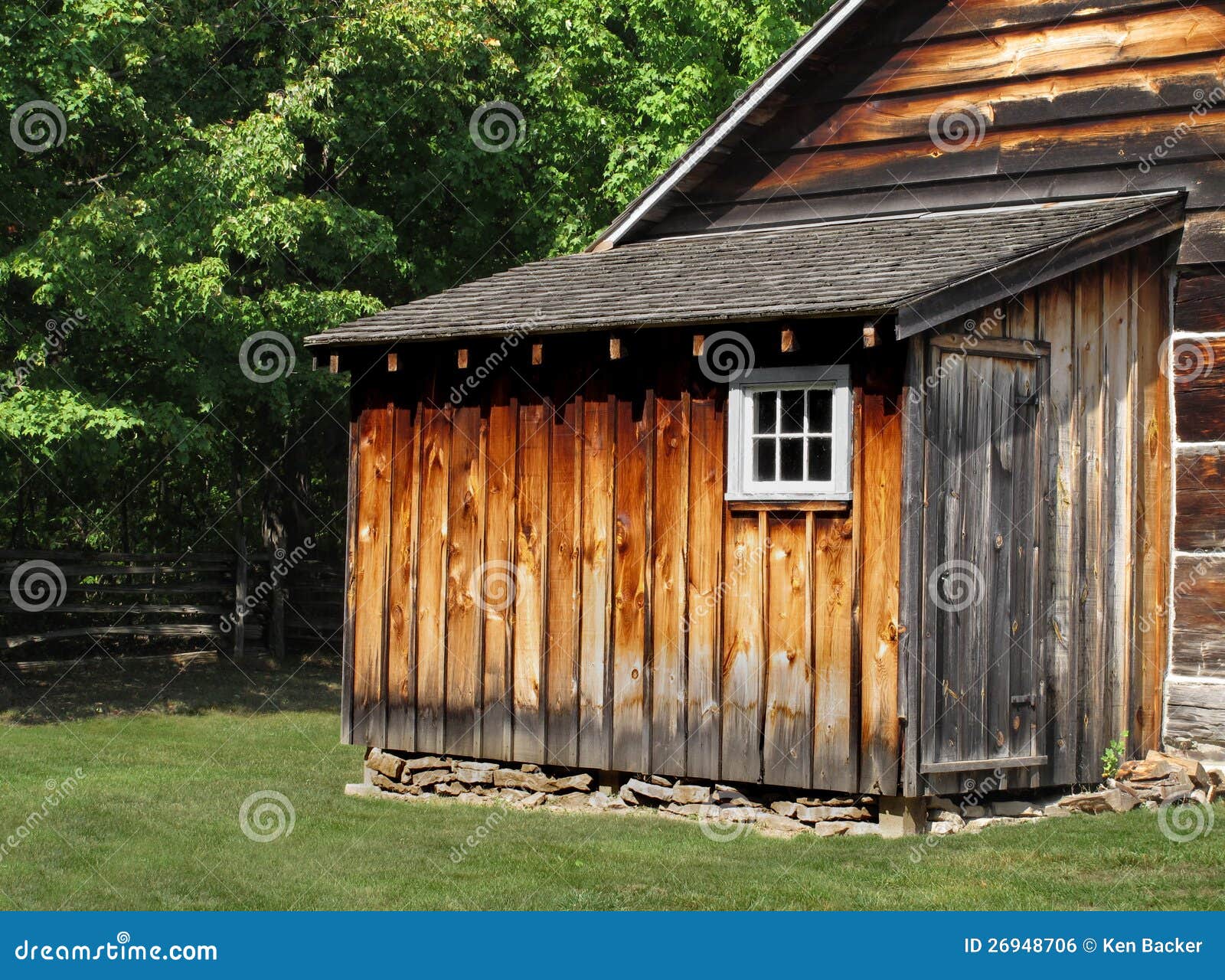 wooden shed with a window and door attached to another wooden building ...