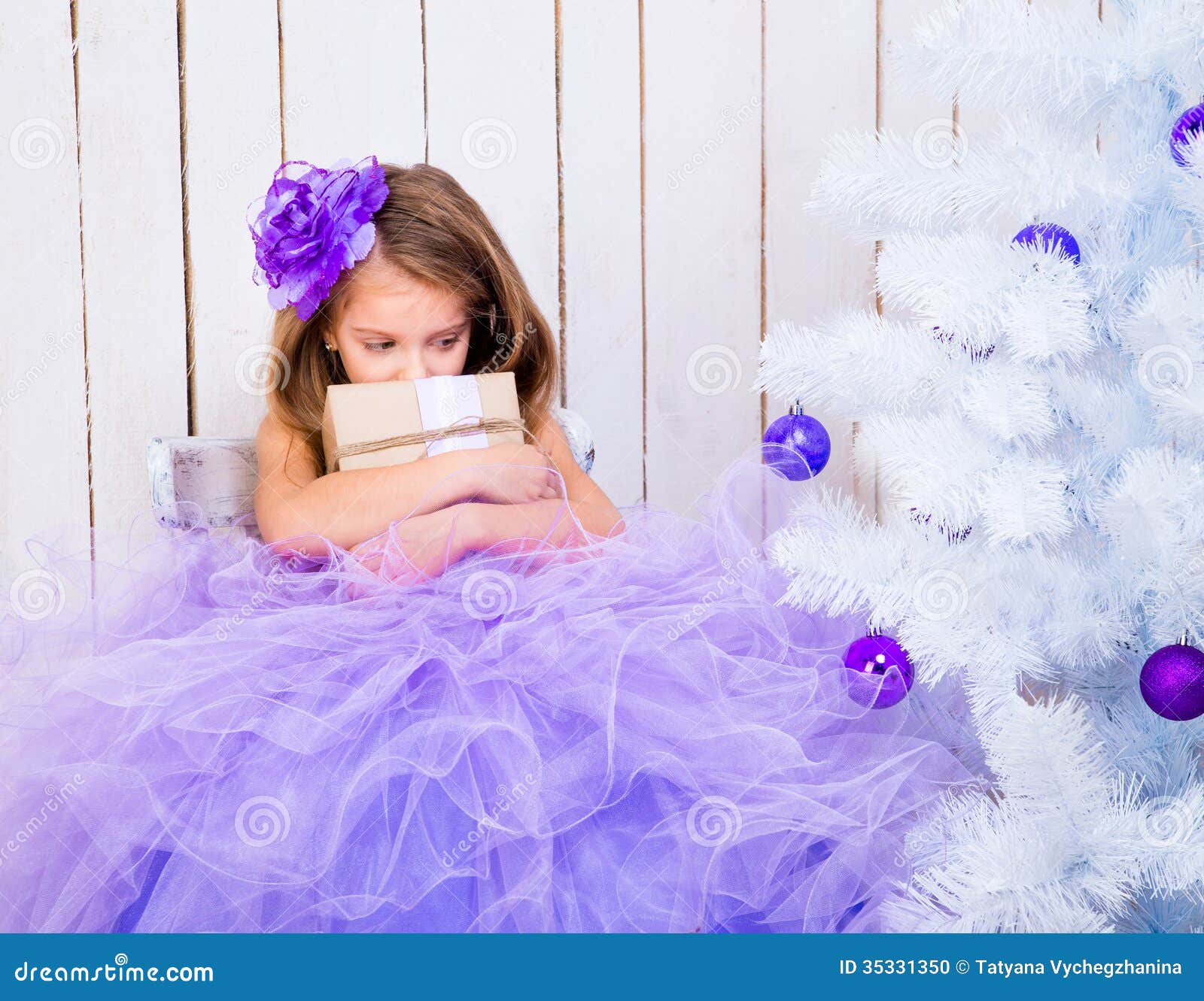 Sad Little Girl With A Gift Stock Photo - Image: 35331350
