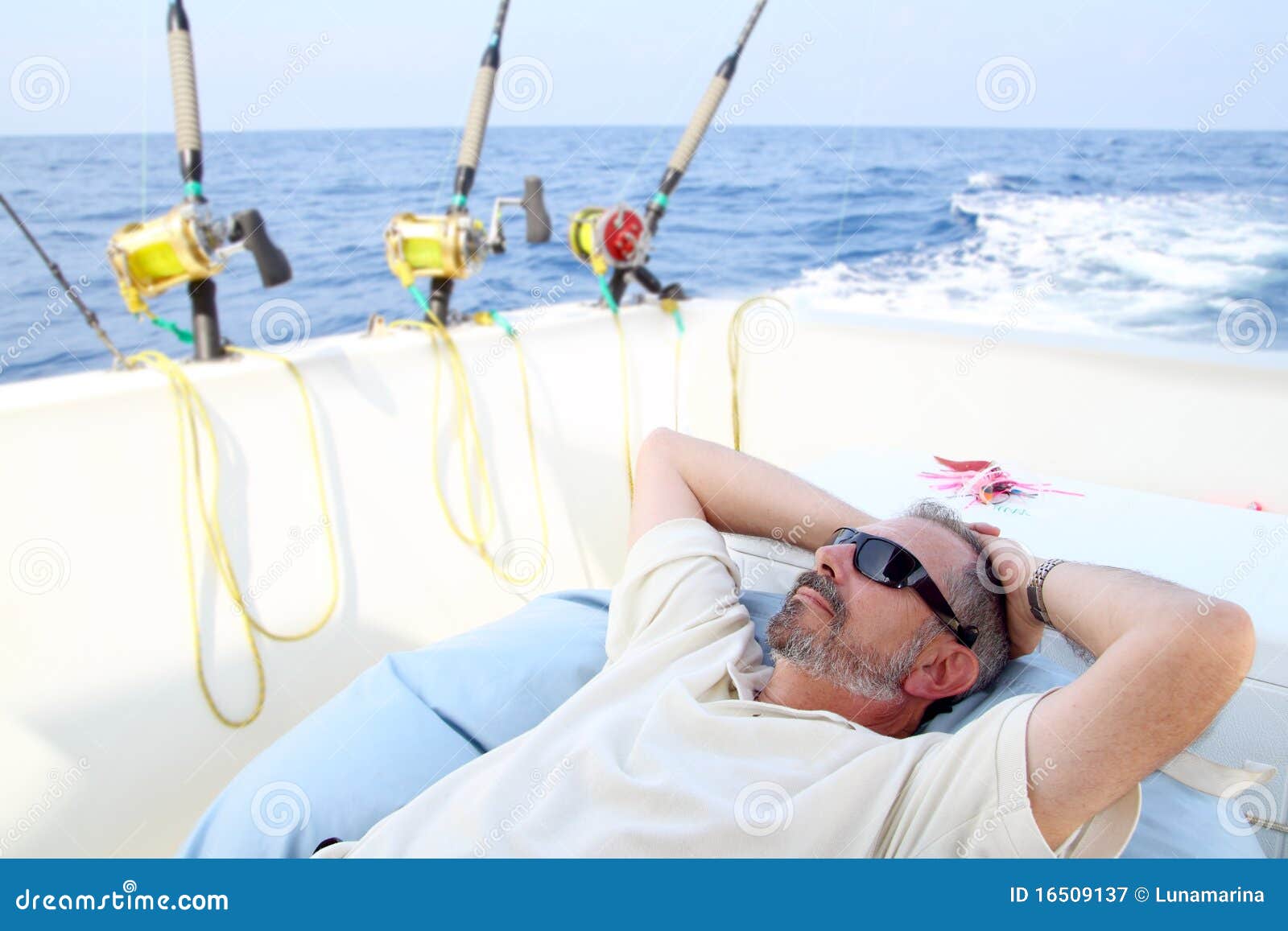  Stock Photography: Sailor senior fisherman relax on boat fishing sea
