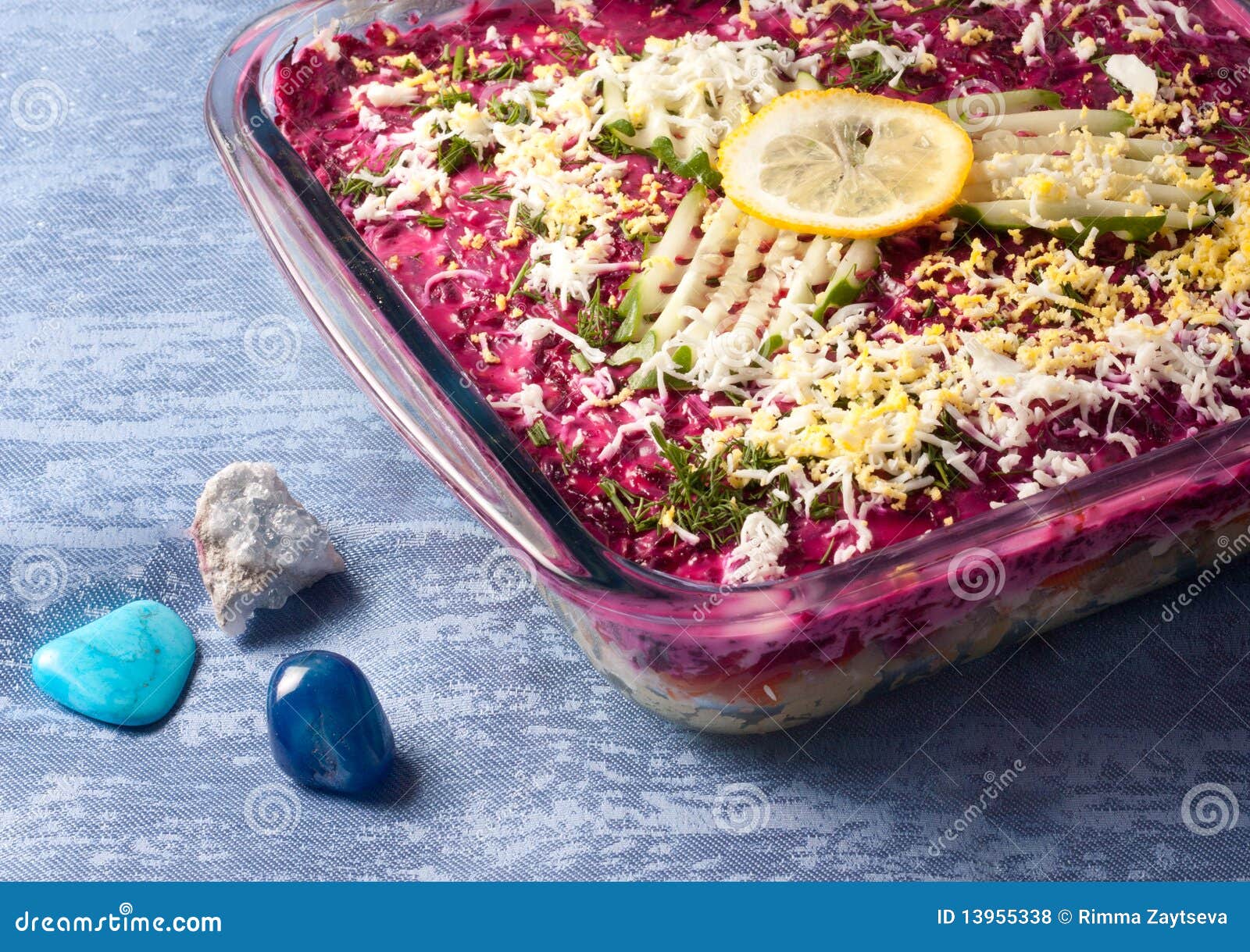 Salad of herring and vegetables on the blue.