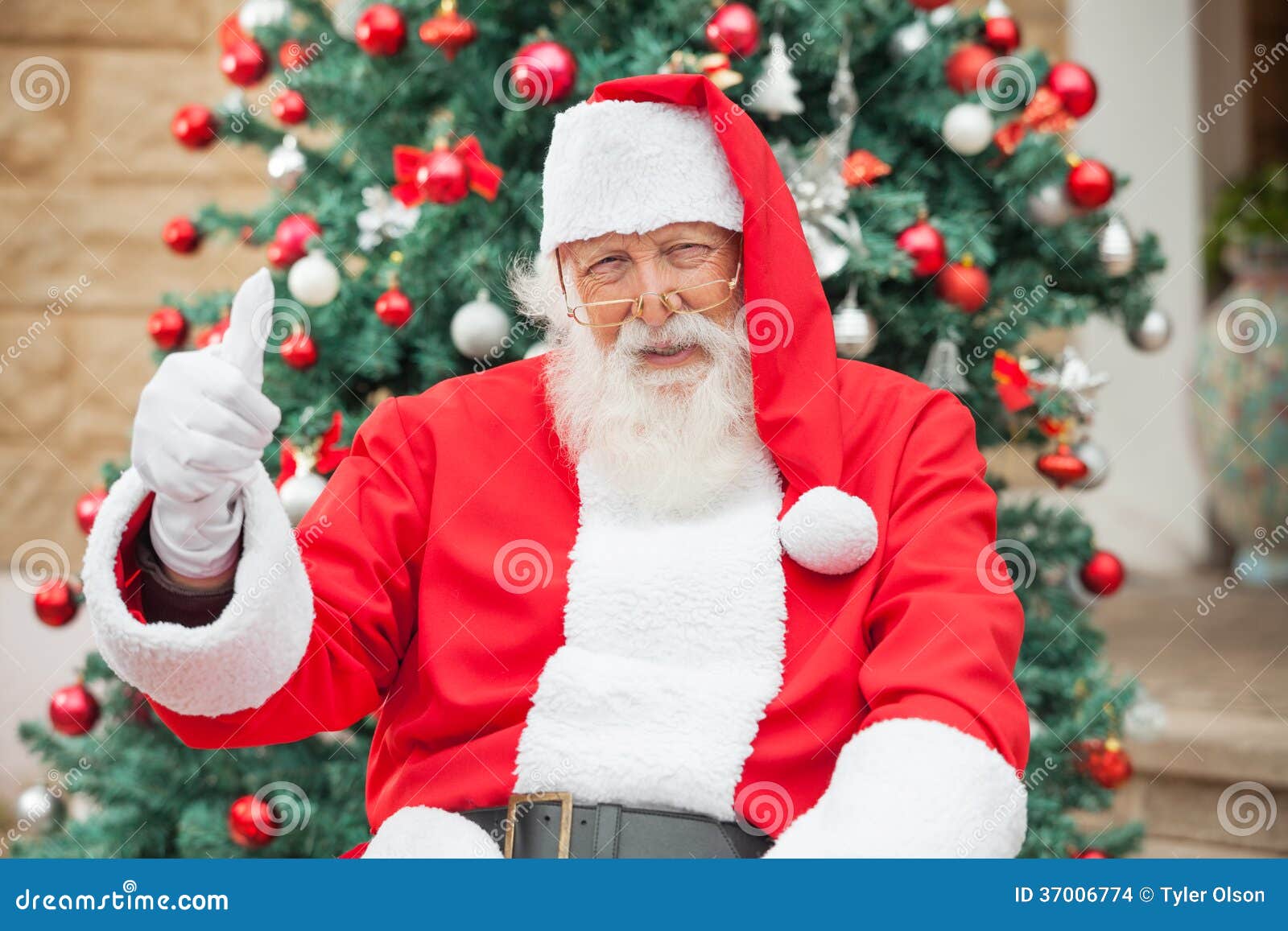 santa claus gesturing thumbsup against christmas stock santa claus gesturing thumbsup against christmas stock