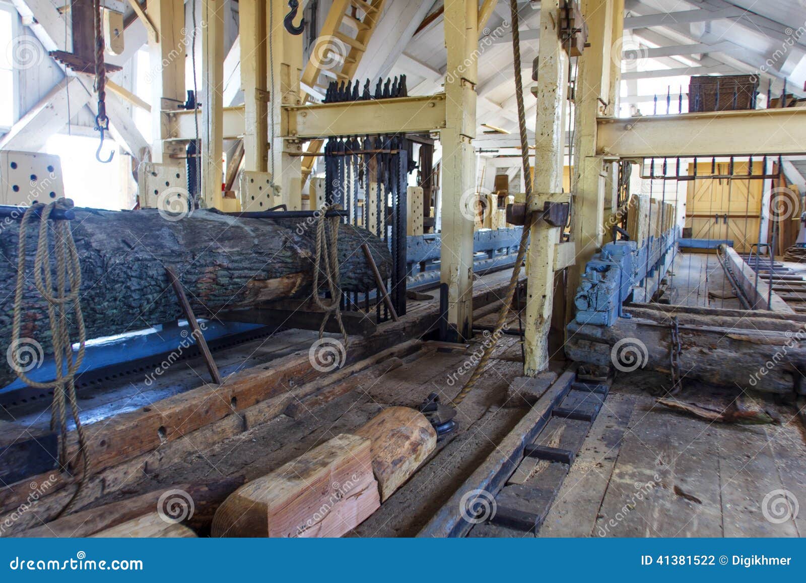 Interior of a sawmill, a facility where logs are cut into lumber or 