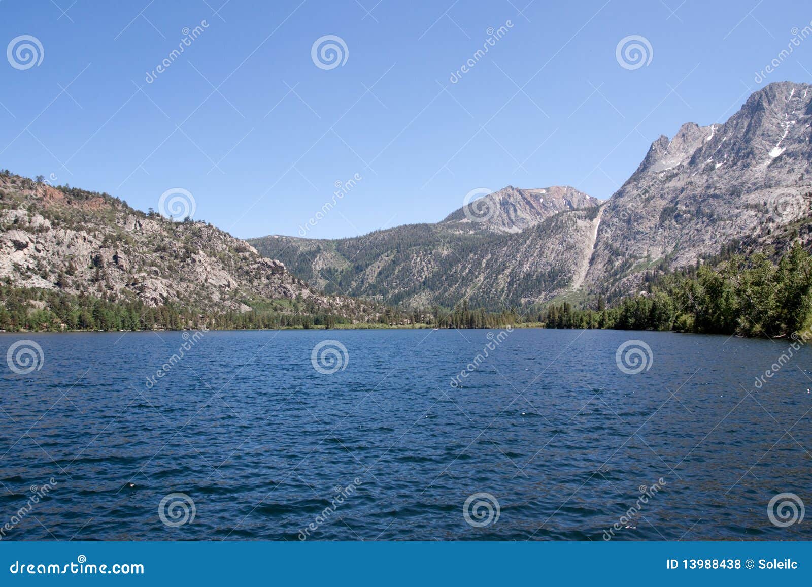 Scenic lake by Sierra Nevada mountain range.