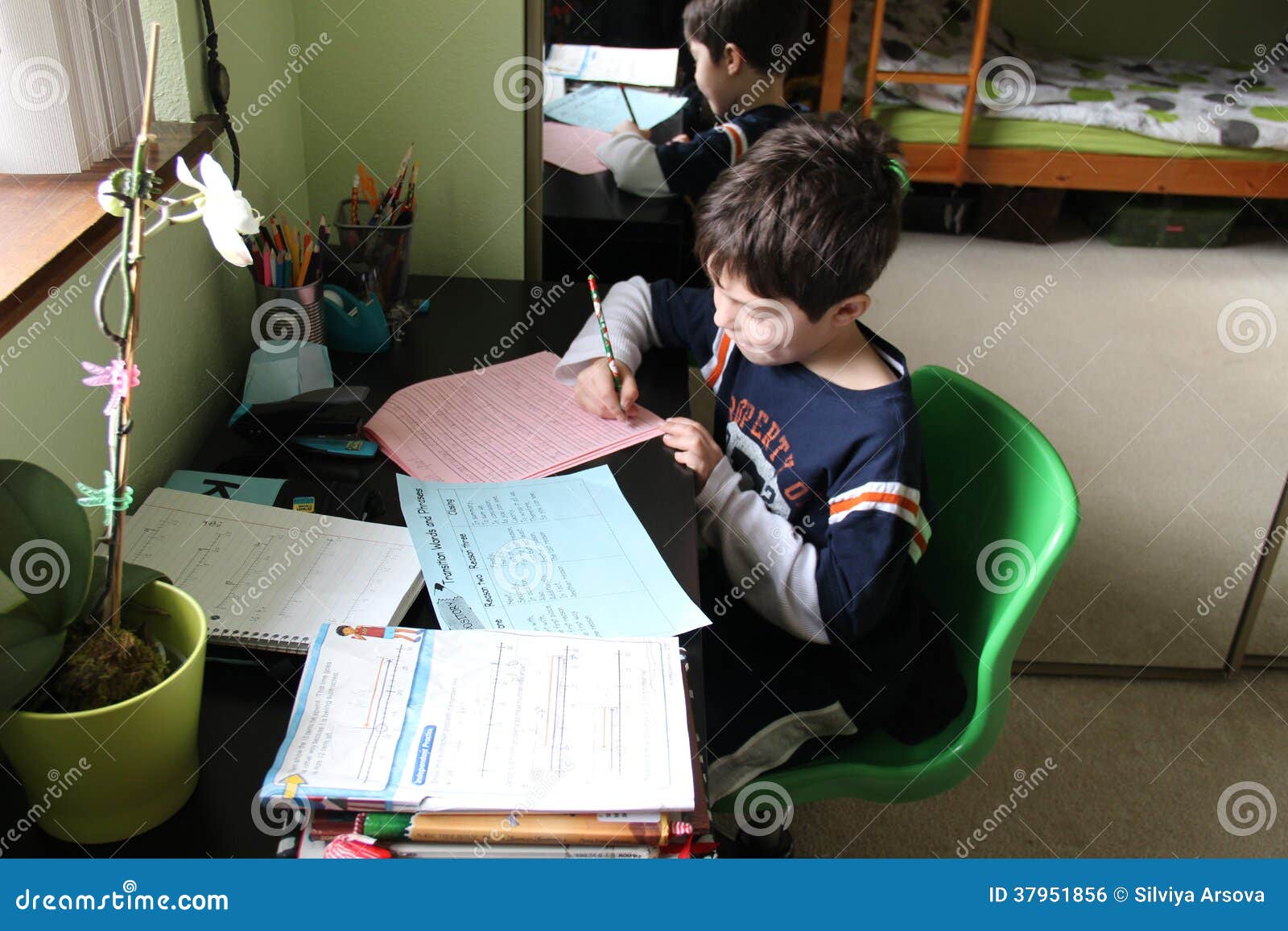 school-work-home-young-kid-doing-his-homework-37951856.jpg
