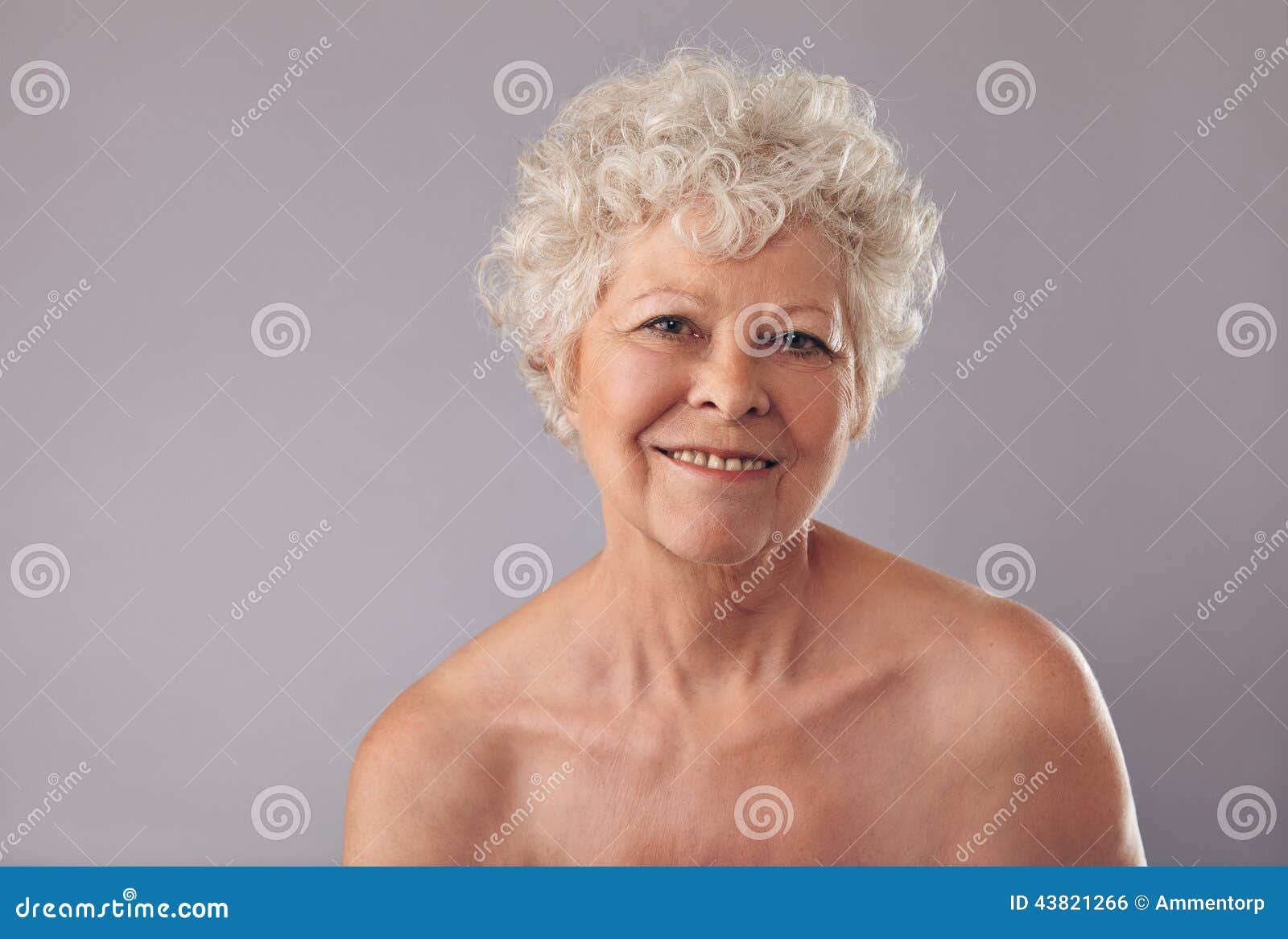 Portrait of Attractive Smiling Elegant Mature Woman on 