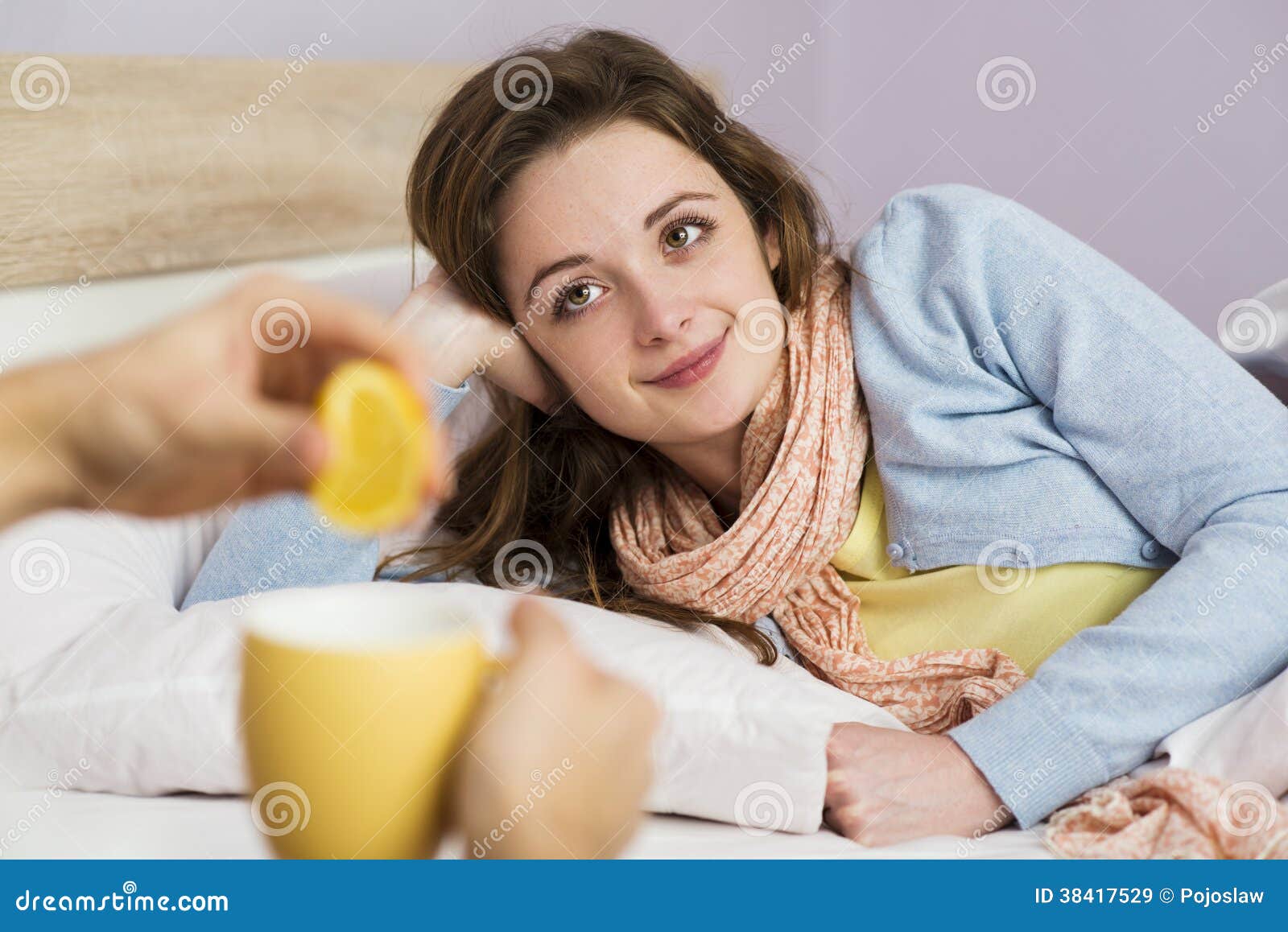 Sick women lying in bed with high fever. She has cold and flu. In ...