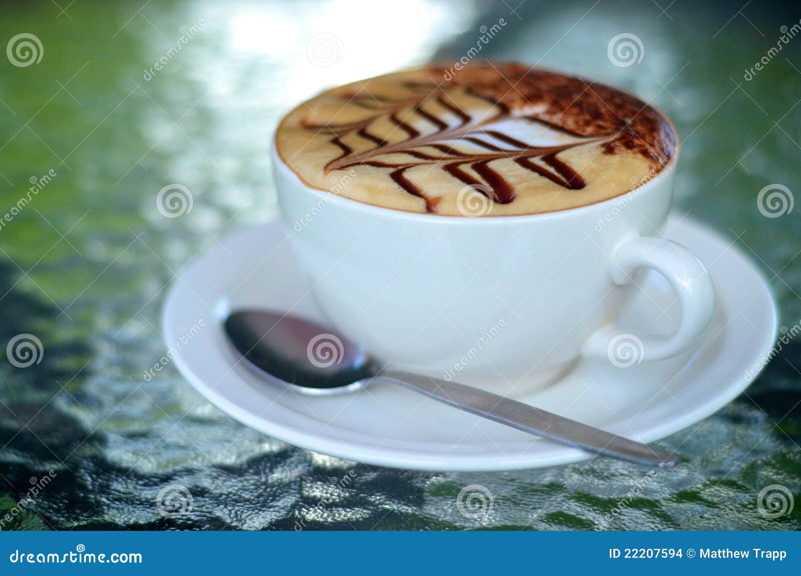  - side-view-cappuccino-coffee-cup-spoon-22207594