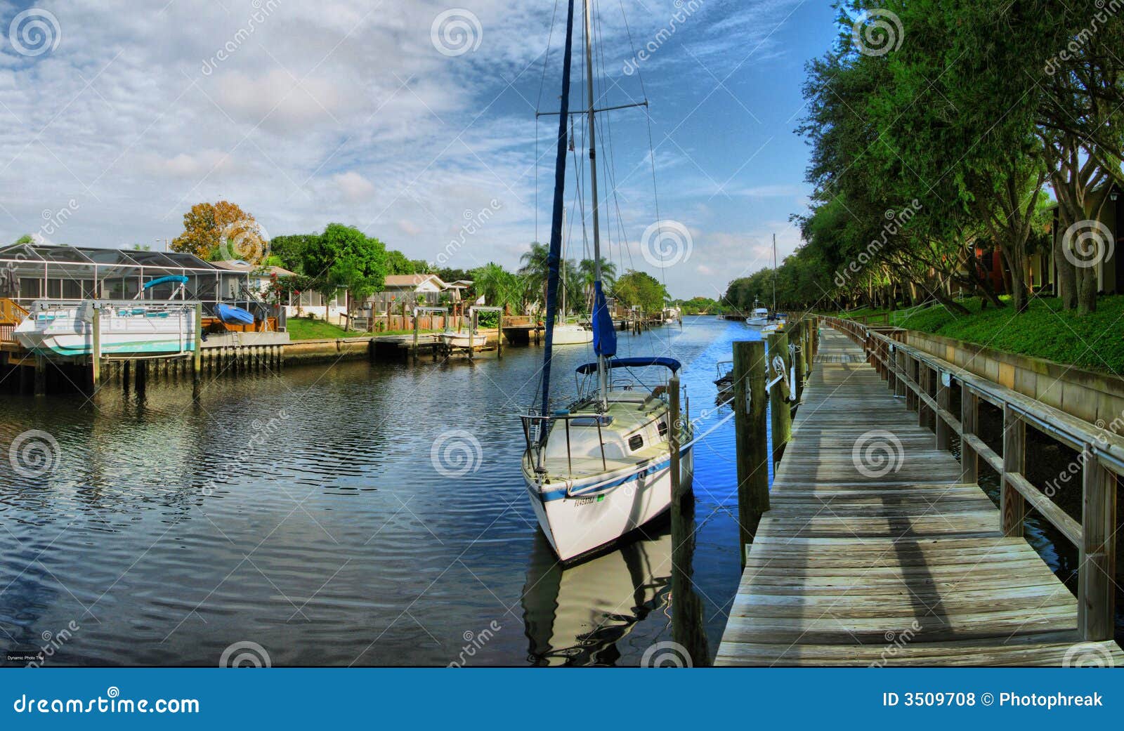 small boat docked in the waterway.