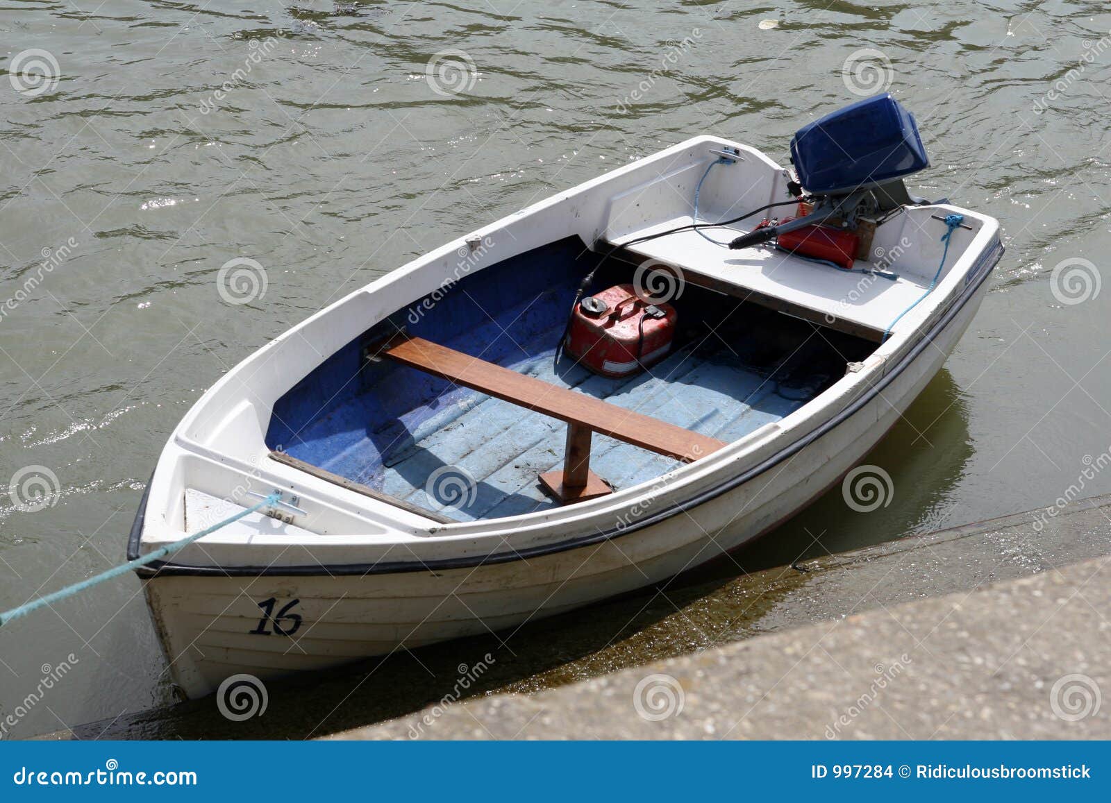 A Small Dinghy Boat On A Tidal Sea River Stock Images 