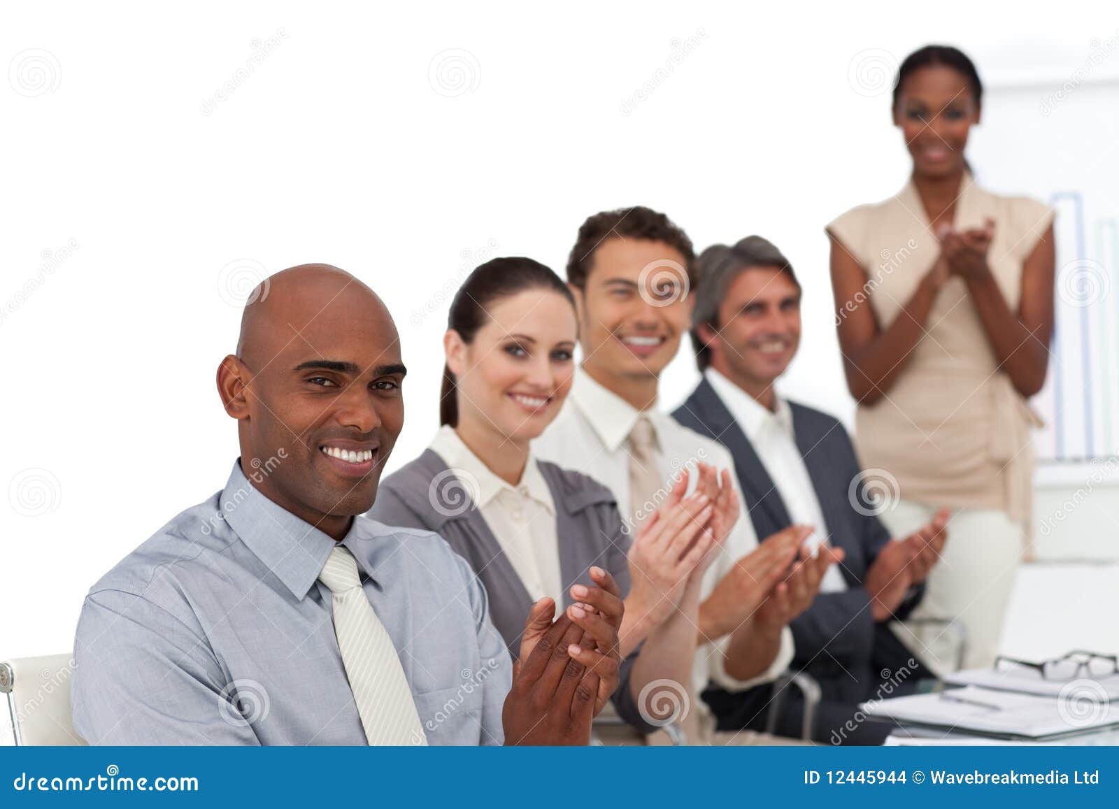 smiling-business-people-applauding-12445944.jpg
