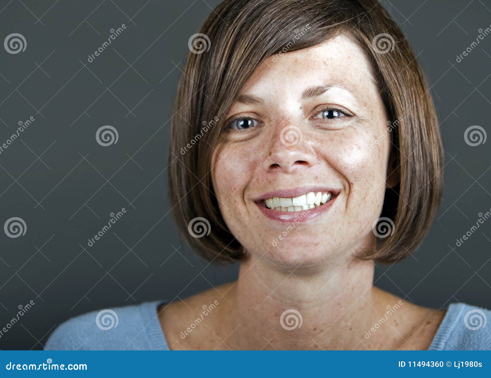 A Smiling Mature Brunette Woman Stock Photo - Image: 11494360