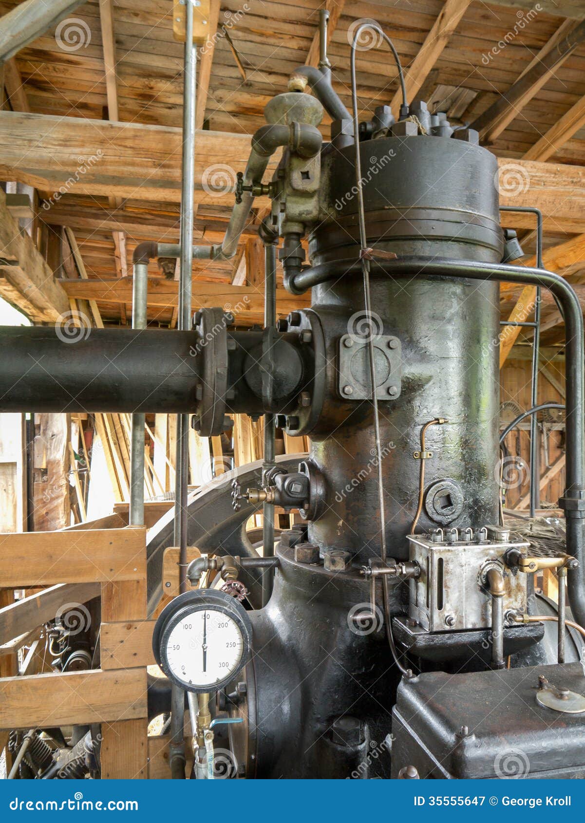 vintage steam motor in an old barn saw mill.