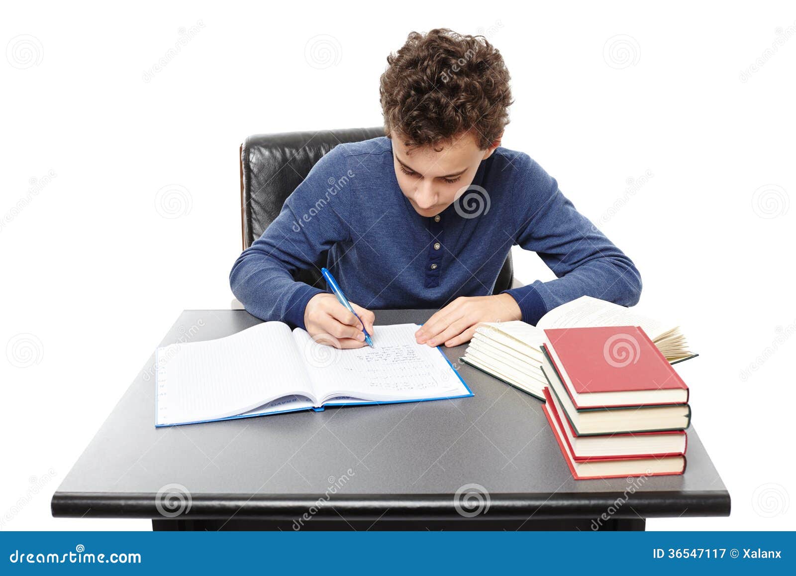 StudentSittingAtHisDeskDoingHisHomeworkRoyalty StudentSittingAtHisDeskDoingHisHomeworkRoyalty