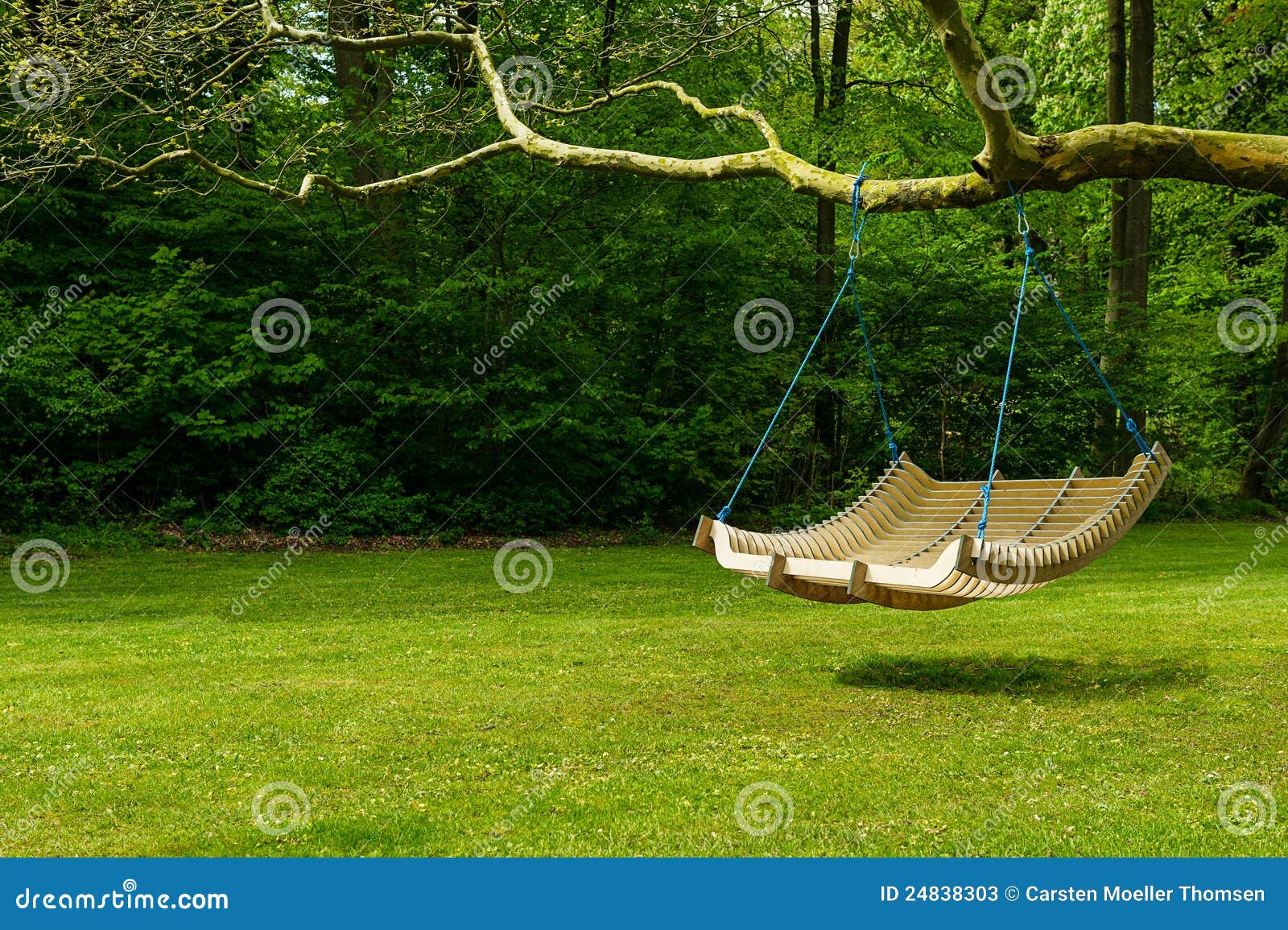 Swing Bench In Lush Garden Stock Photos - Image: 24838303