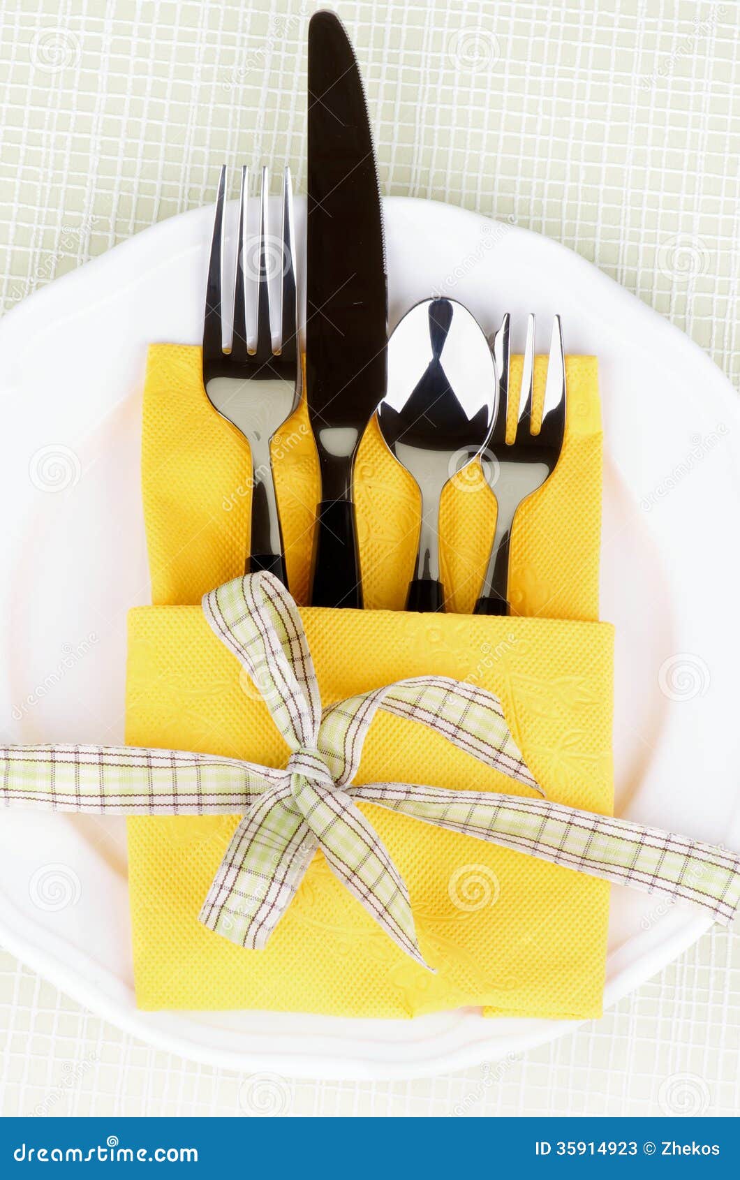 Elegant Table Setting with Fork, Table Knife, Spoon and Dessert Fork 