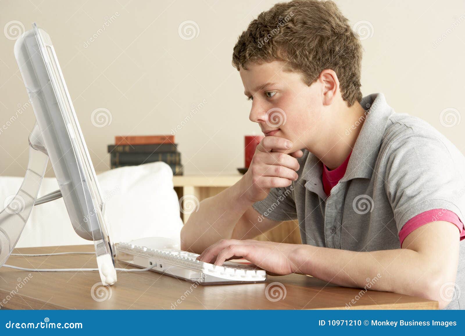 Boy In Thought Studying At Home Boy In Thought Studying At Home Stock Photo