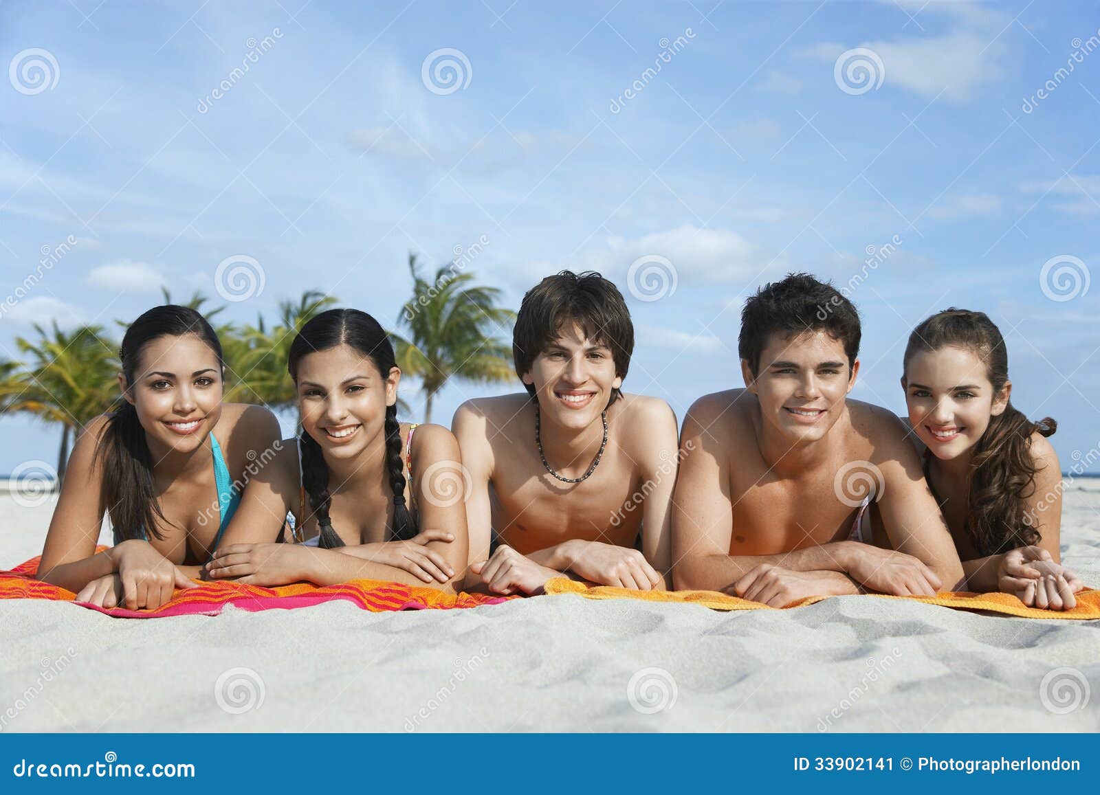 Lying On The Beach With Friends