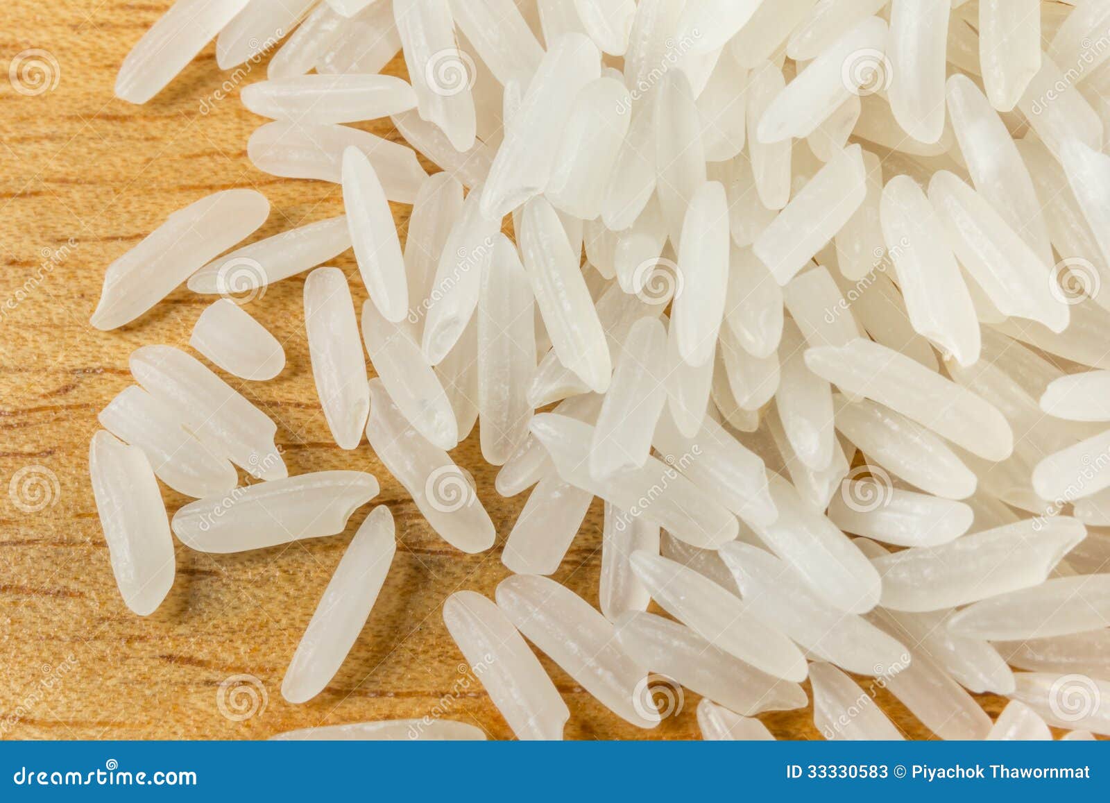  - thai-jasmine-rice-raw-white-close-up-wood-background-33330583