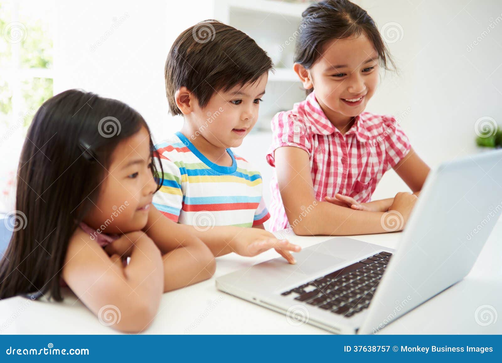Three Asian Children Using Laptop At Home Royalty Free ...