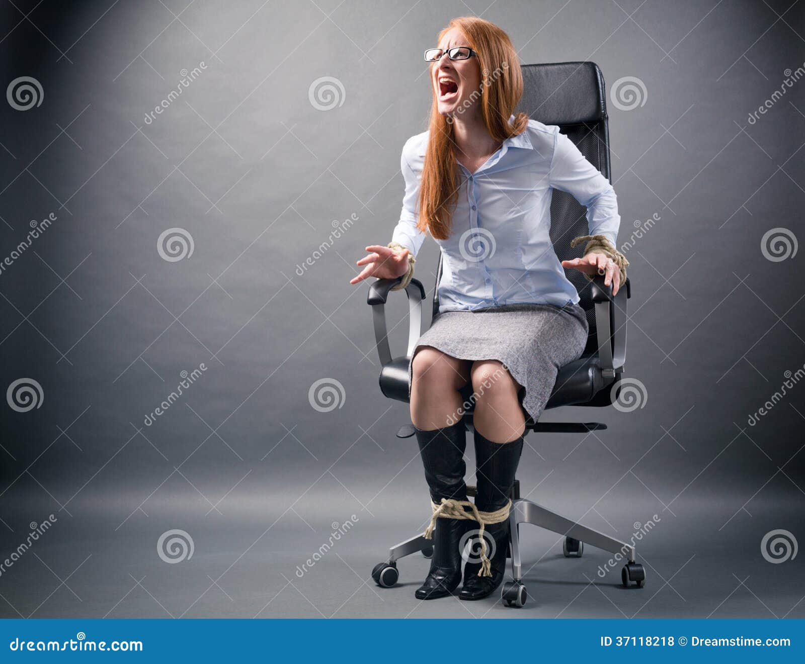 tied-up-woman-no-freedom-business-young-businesswoman-confined-to-office-chair-shouting-help-trying-to-free-37118218.jpg