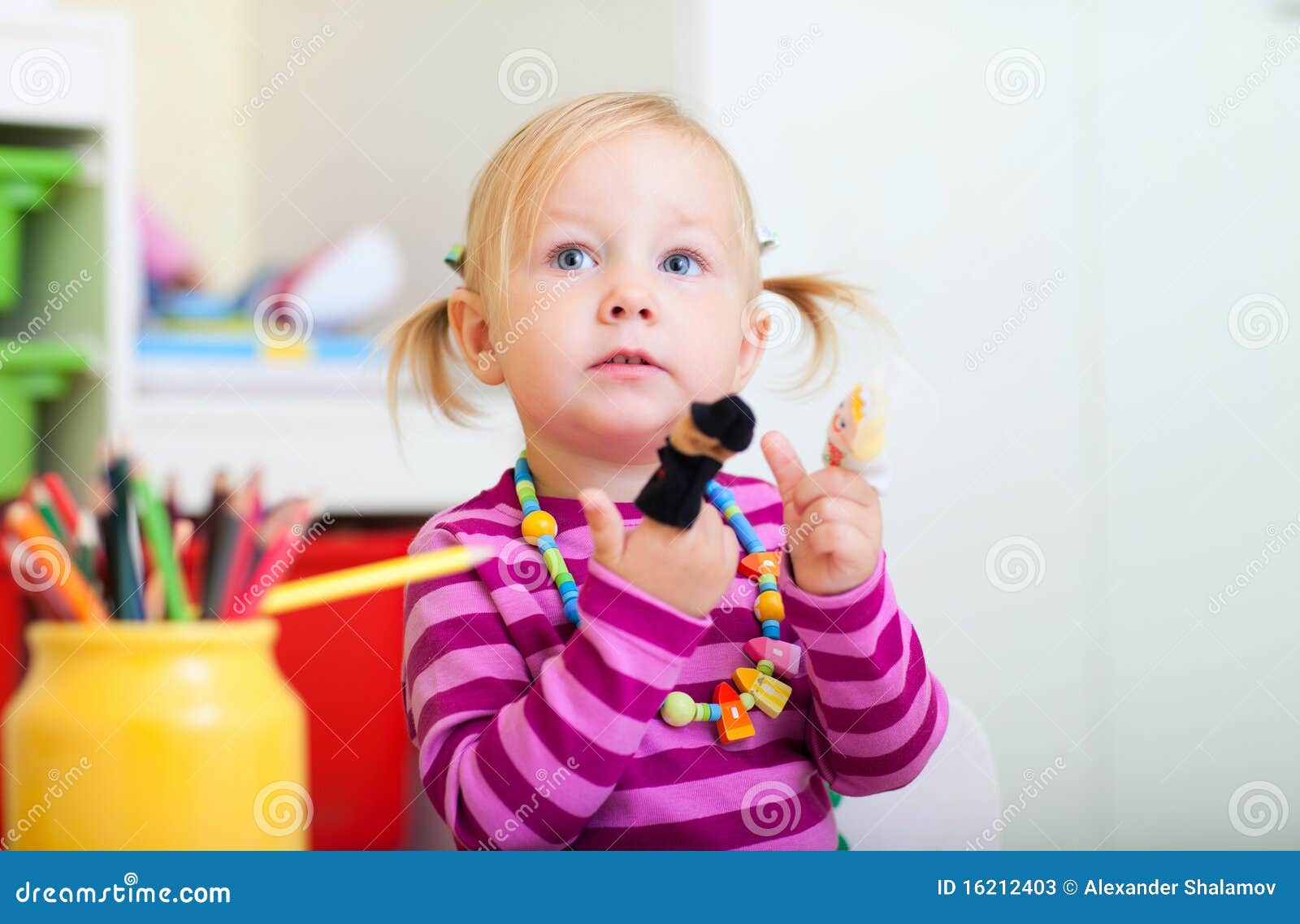 Toddler Girl Playing With Finger Toys Stock Photos Image 16212403