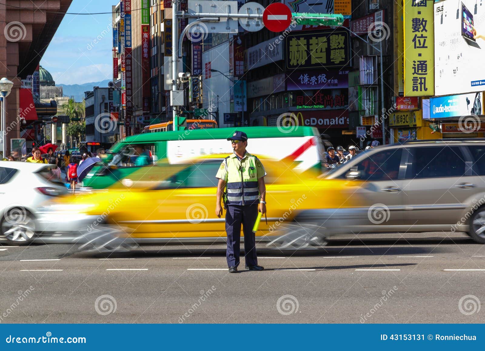 taiwan new year traffic traffic warden directs peak hour traffic in tapei taiwan new year traffic traffic warden directs peak hour traffic in tapei