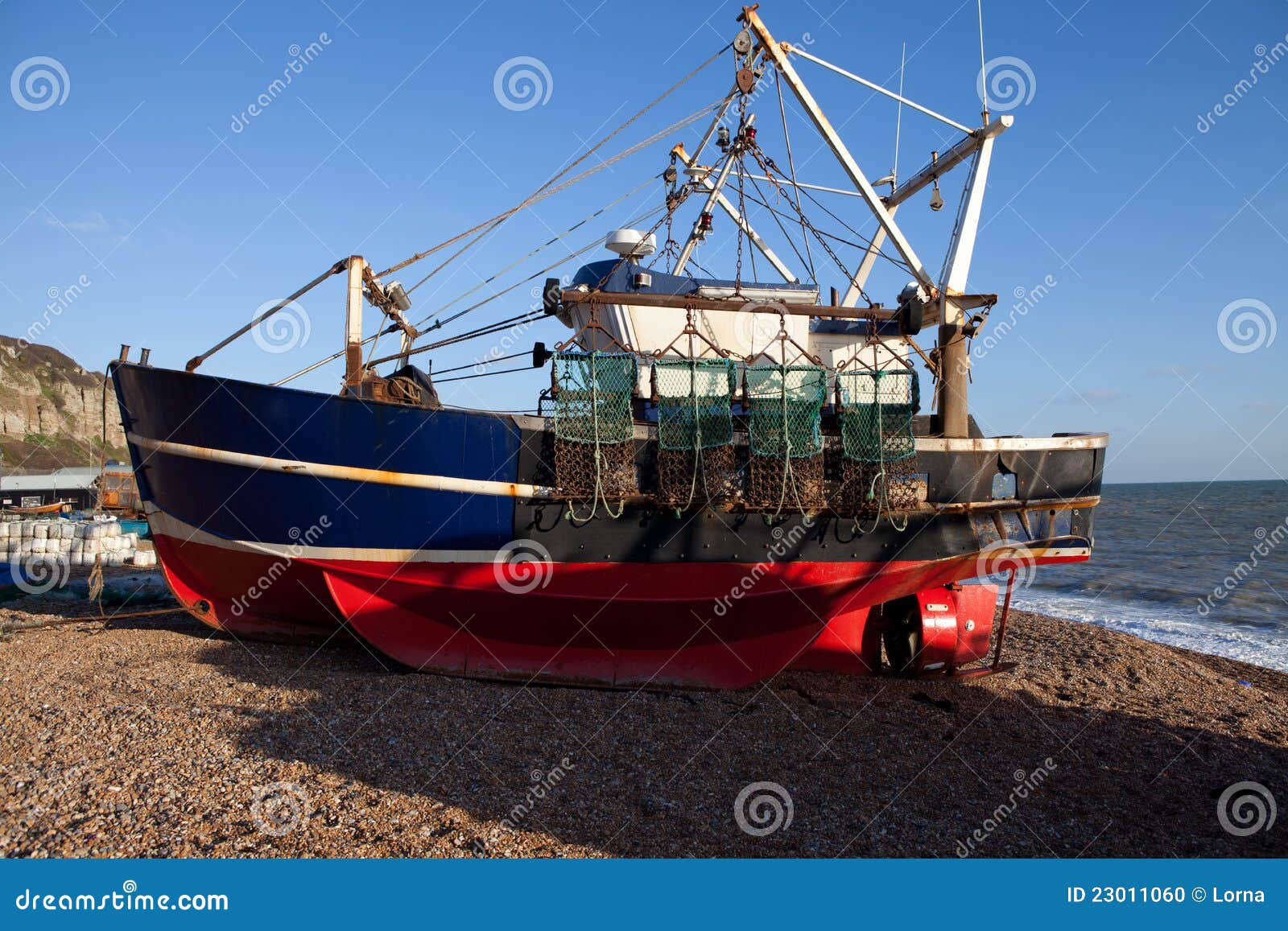 Fishing industry, trawler or fishing boat on the beach in seaside 