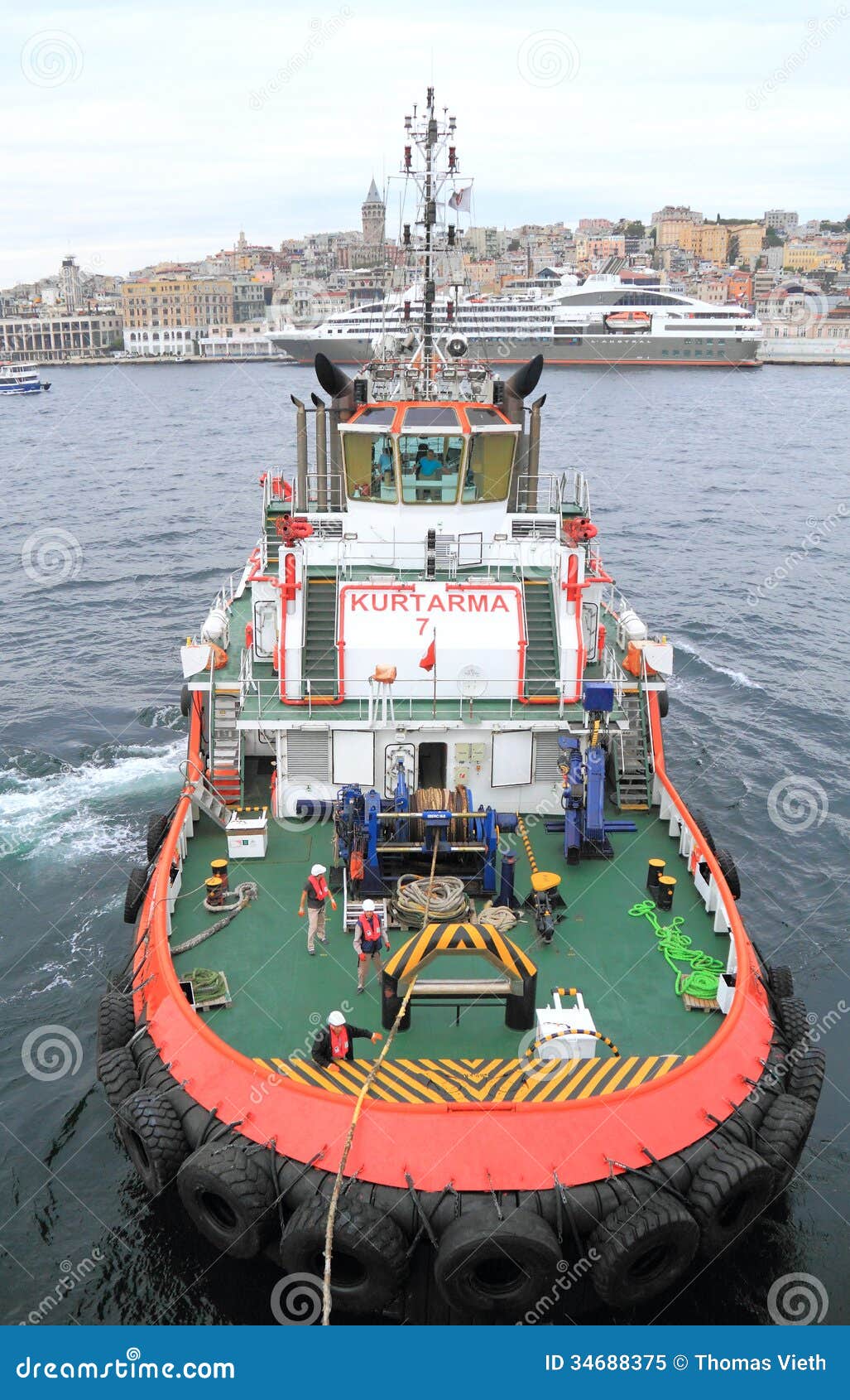  - tugboat-istanbul-harbor-pulling-cruise-ship-crowded-passenger-open-waters-famous-galata-tower-34688375