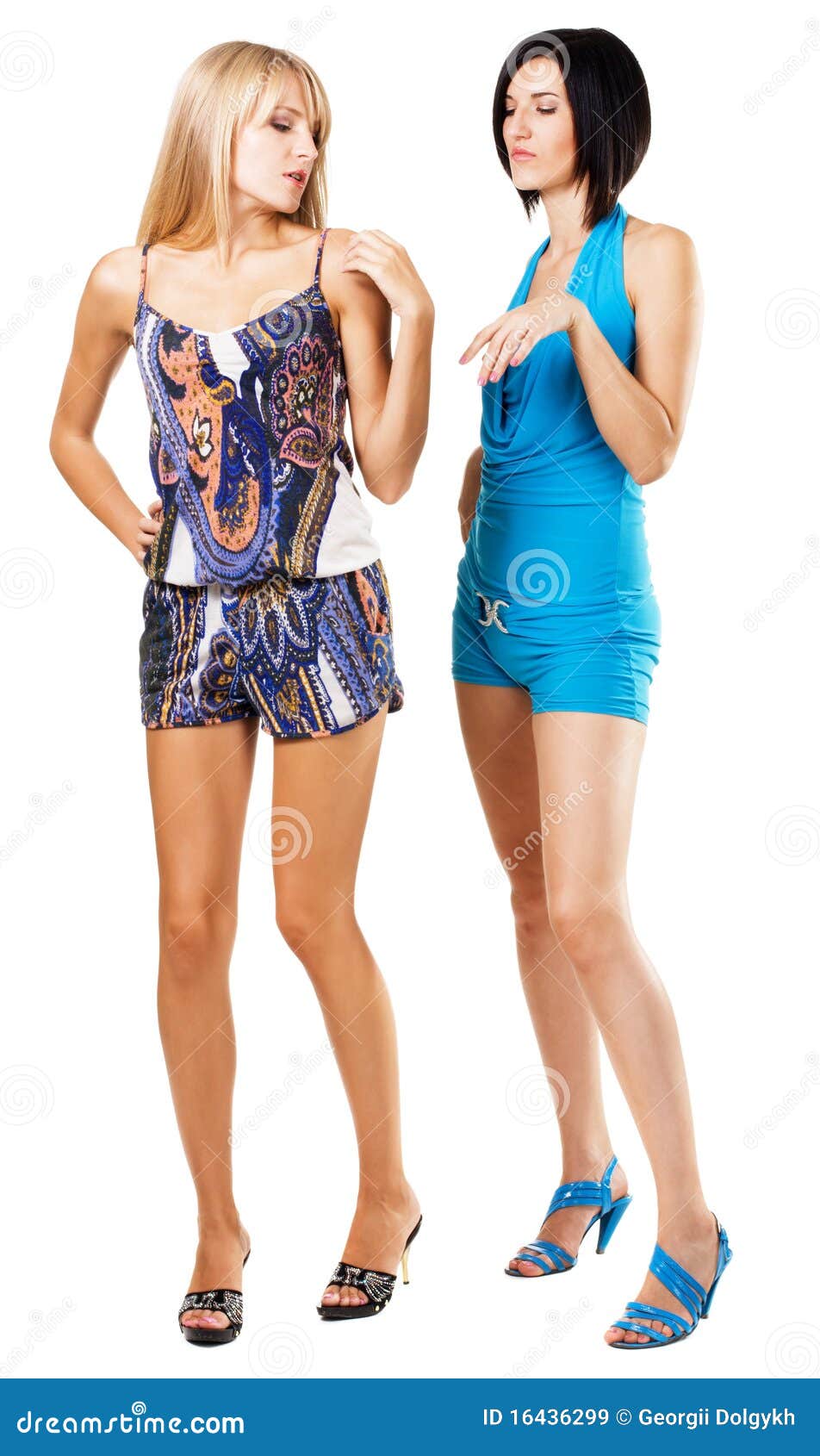 Two fashionable women in colorful clothing, white background