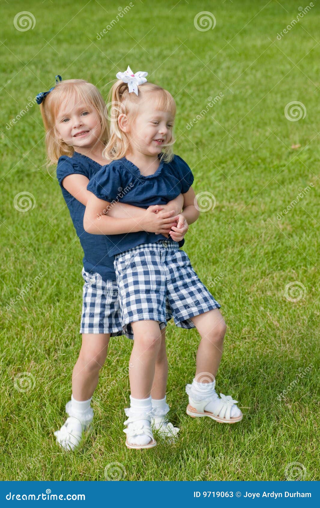 Two Little Girls Hugging Stock Photos - Image: 9719063