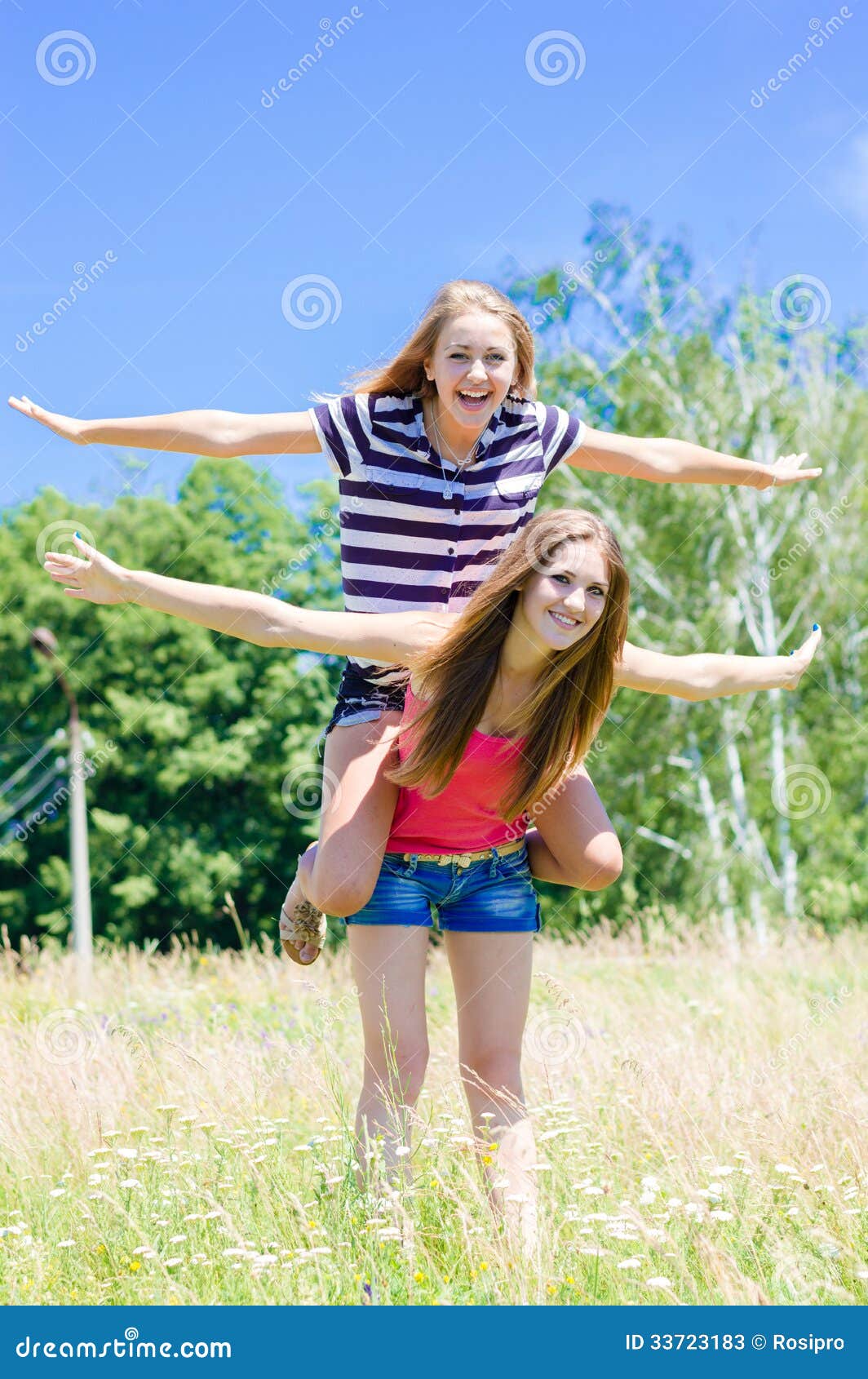 Two Teenage Girl Friends Having Fun Outdoors On Summer Day Stock Photos Image